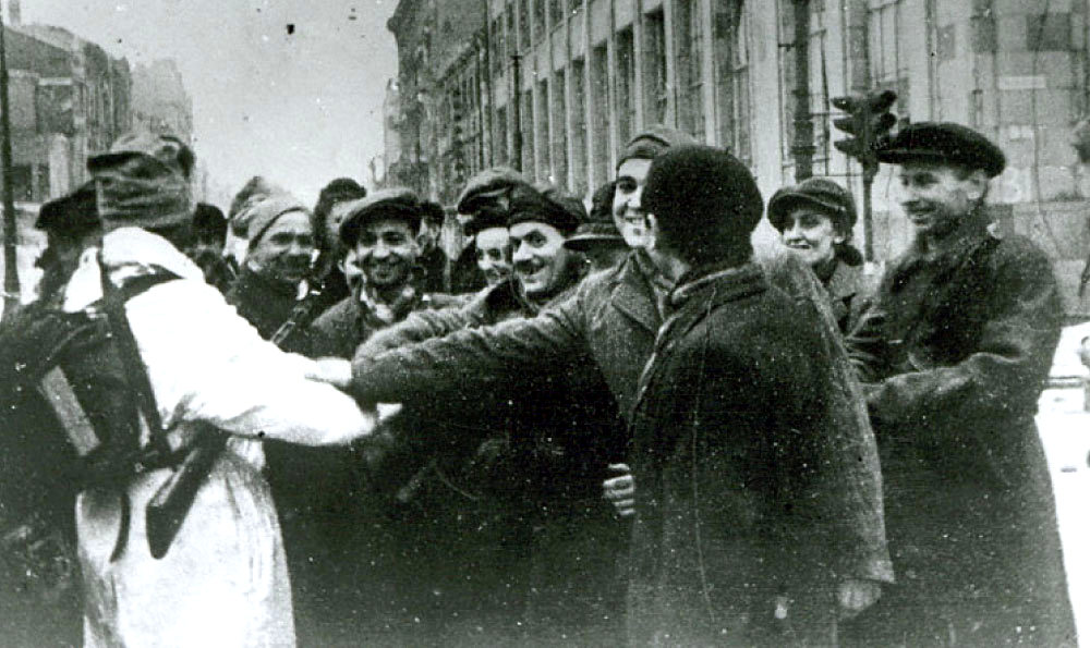 Warsaw residents greet a Russian soldier, January 1945