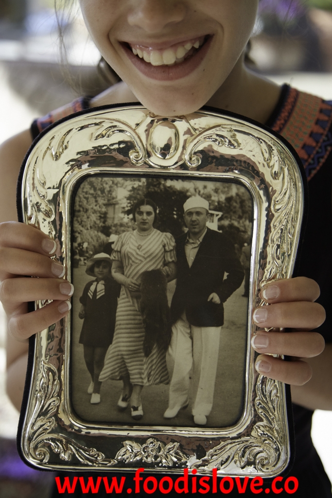 Grand-daughter Taya holds a picture of Celina aged 5, with her parents Joseph and Genia Wald on holiday in 1936. The only family photos which Ruth and Celina have are those their parents had sent to relatives overseas. All their own family photos were destroyed during the War. 