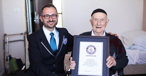 Marco Frigatti and Yisrael Kristal, when he was 'only' 112. (Dvir Rosen/Guinness World Records/Associated Press)