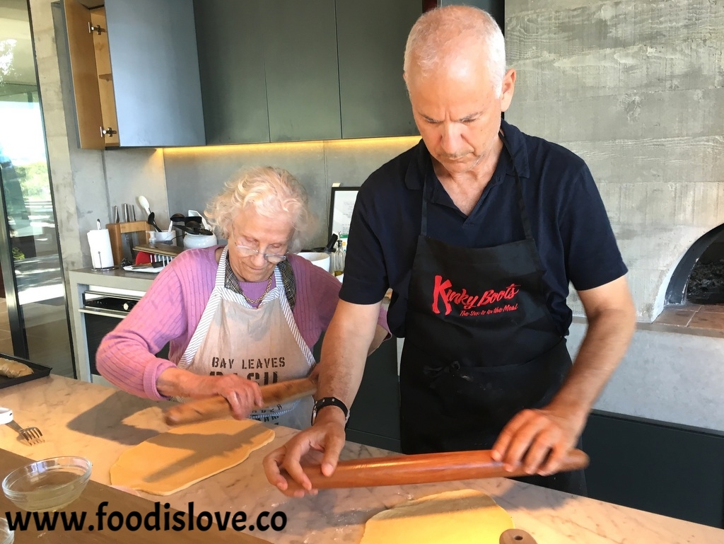Baba baking yeast rolls with her son Alan Schwartz. When he's not cooking his mother's specialties, he's branched out, baking artisanal breads using different flours and grains . 