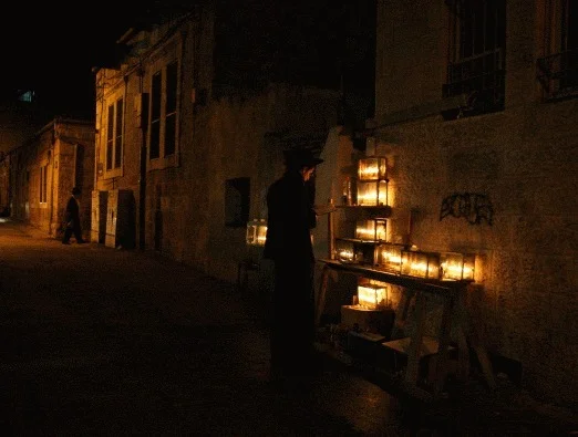  In the Ultra-Orthodox suburbs of Jerusalem, the Hannukah candles are often lit outside in the streets, and glow in the night. 