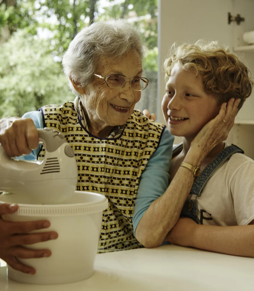 Thea Riesel preparing latkes with her grandson Jono Riesel. 