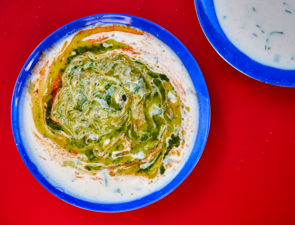 Tahina, with Grandma Rina's green hot sauce. 
