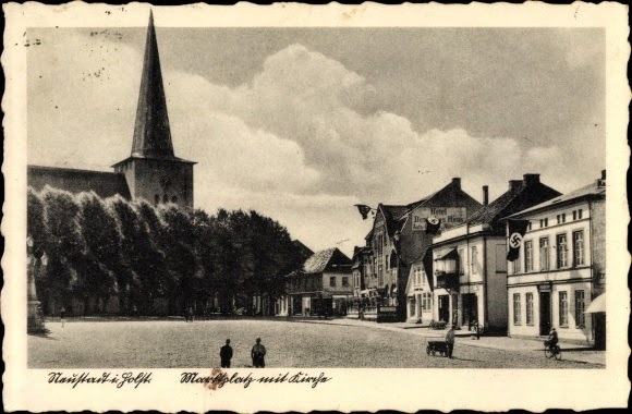 A postcard of the town of Neustadt flying swastikas during WWII. 