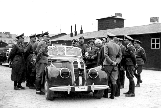 Chaim Rumkovski, controversial Jewish leader of the Lodz Ghetto, meeting with Nazi officials, including SS Chief Heinrich Himmler (seated in car) Lodz, 5 Jun 1941