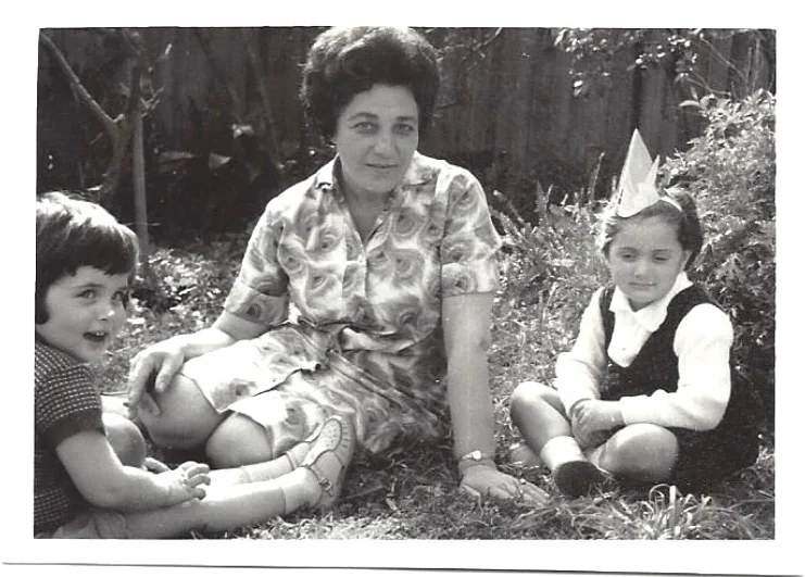 Me and my cousin Arli in the backyard with Grandmother Lea, Sydney.