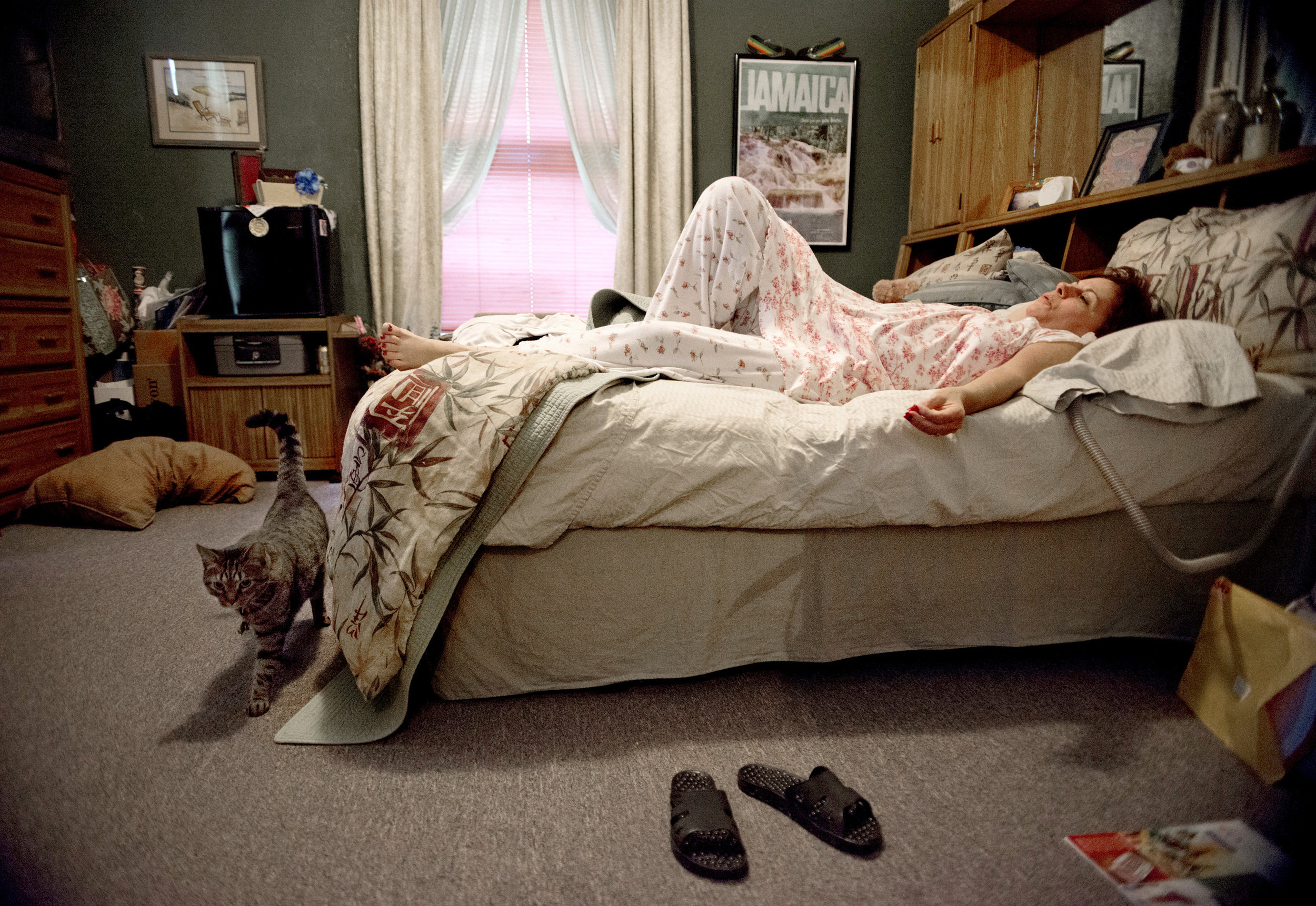 Gayle Ayala lies in her bed in her apartment at the Hospitality House in Chester Ill. on her day off from the four jobs she works. She moved 850 miles from Fairfax, Va. to Chester, Ill. to be near her husband, David Ayala, who was an inmate at Tamms Correctional Center, a Maximum Security prison, until he was transferred to a prison in Nevada (where he and Gayle now live) in Chester, Ill. Gayle and David met through inmate essay-writing program, Tamms Year 10. She fell in love with him in May of 2009, and the couple was engaged Jan. 1, 2010. She quit her job as a legal secretary, where she was earning nearly six figures, and moved to Chester. Through the Hospitality House Gayle has found comfort in meeting other women married to men with long-term or life sentences. She describes it as a sisterhood.