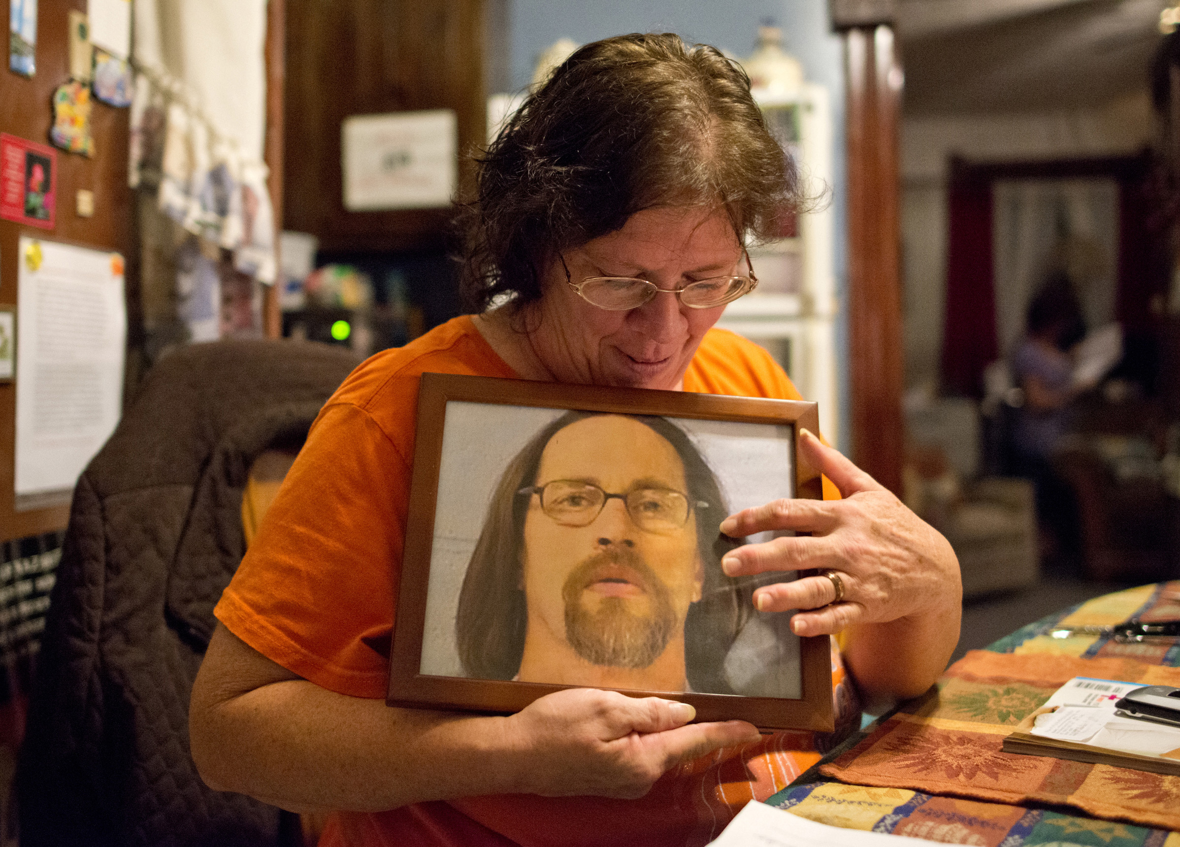 Sheryle Moore holds a photo of her husband Marty. She and her husband also met through an inmate essay program, and decided to meet after they formed a connection through their letters. Moore said Marty was on death row, but his sentence was changed to life in prison. Their wedding ceremony was held in July of 2011 in Menard Correctional Center. Moore moved from Indiana with 86 dollars in her pocket to be closer to Marty, and has been staying at the Hospitality House under the condition that she help with finances and household chores.