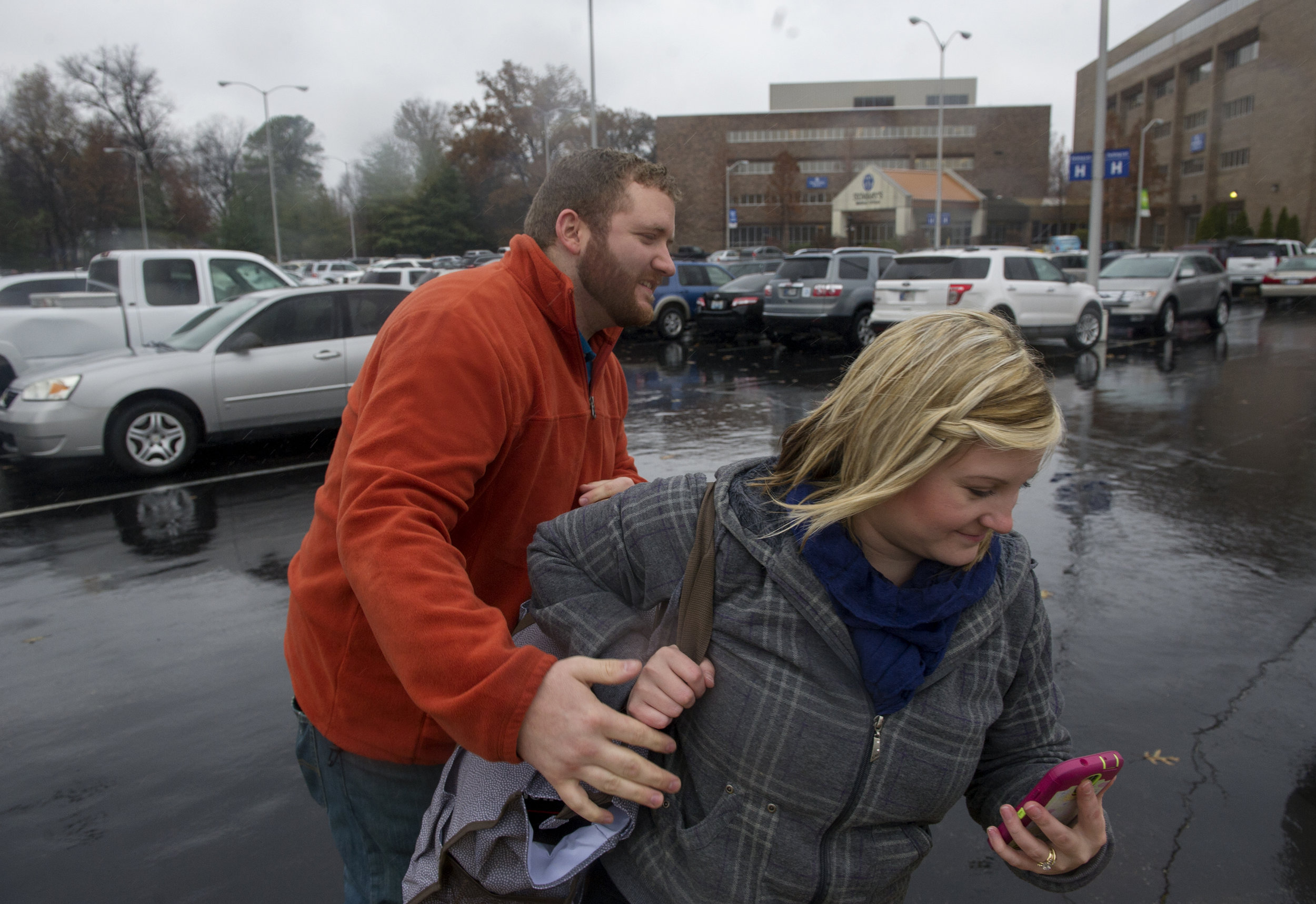  Erickia greets Michael in the parking lot the day Angelica goes into labor at St. Mary's Medical Center in Evansville Monday Dec. 1, 2014.   