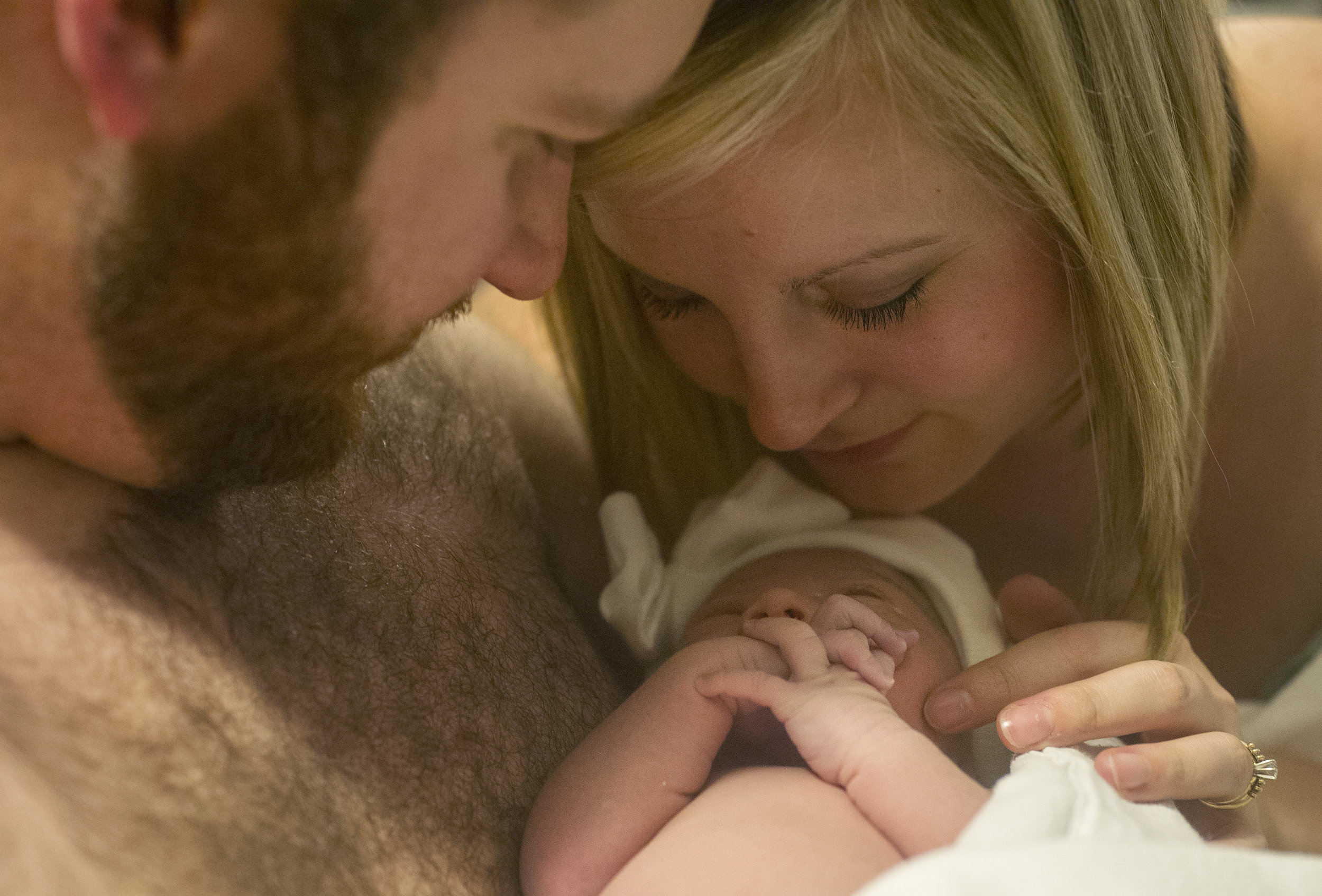  Michael and Erickia hold their daughter skin-to-skin together for the first time after she is born at St. Mary's Medical Center in Evansville Monday Dec. 1, 2014.   
