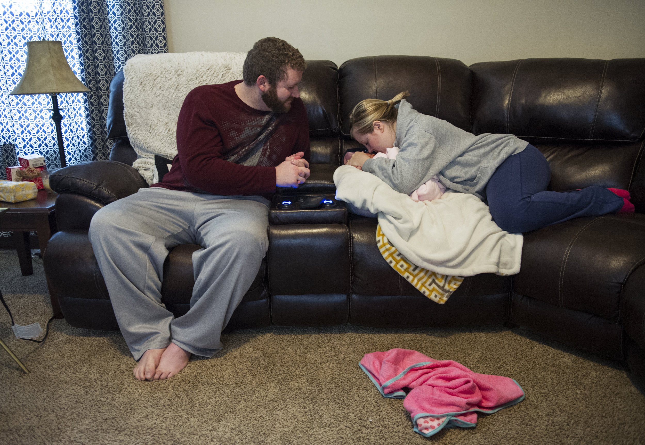  Michael and Erickia gush over Gracelyn at their home in Evansville Thursday Dec. 11, 2014. Since they brought her home they have spent their time enjoying getting to know her and showing her off to their friends and relatives. "My heart is overflowi