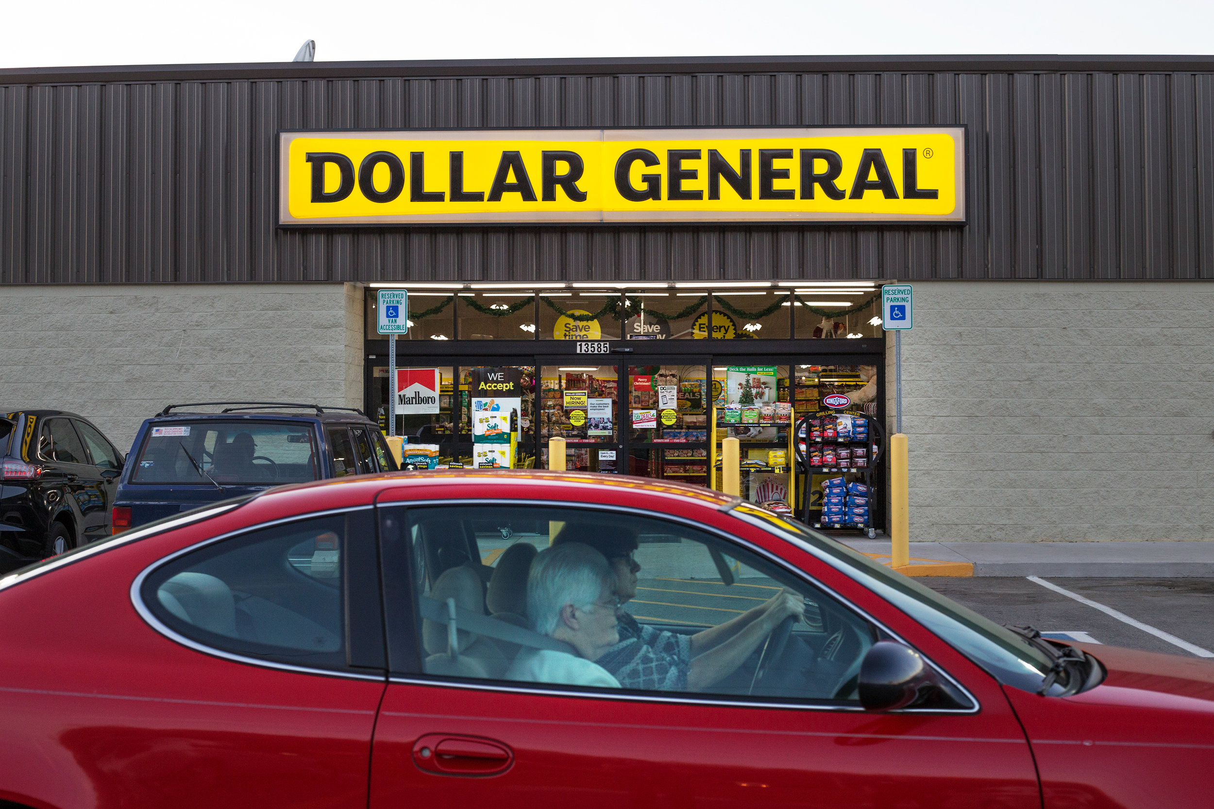  Customers exit the parking lot at the Dollar General in Evensville, Tenn. Thursday, Nov. 16 2017. Dollar General has been opening stores in rural areas, particularly food deserts where residents usually within five miles will go to shop for their gr