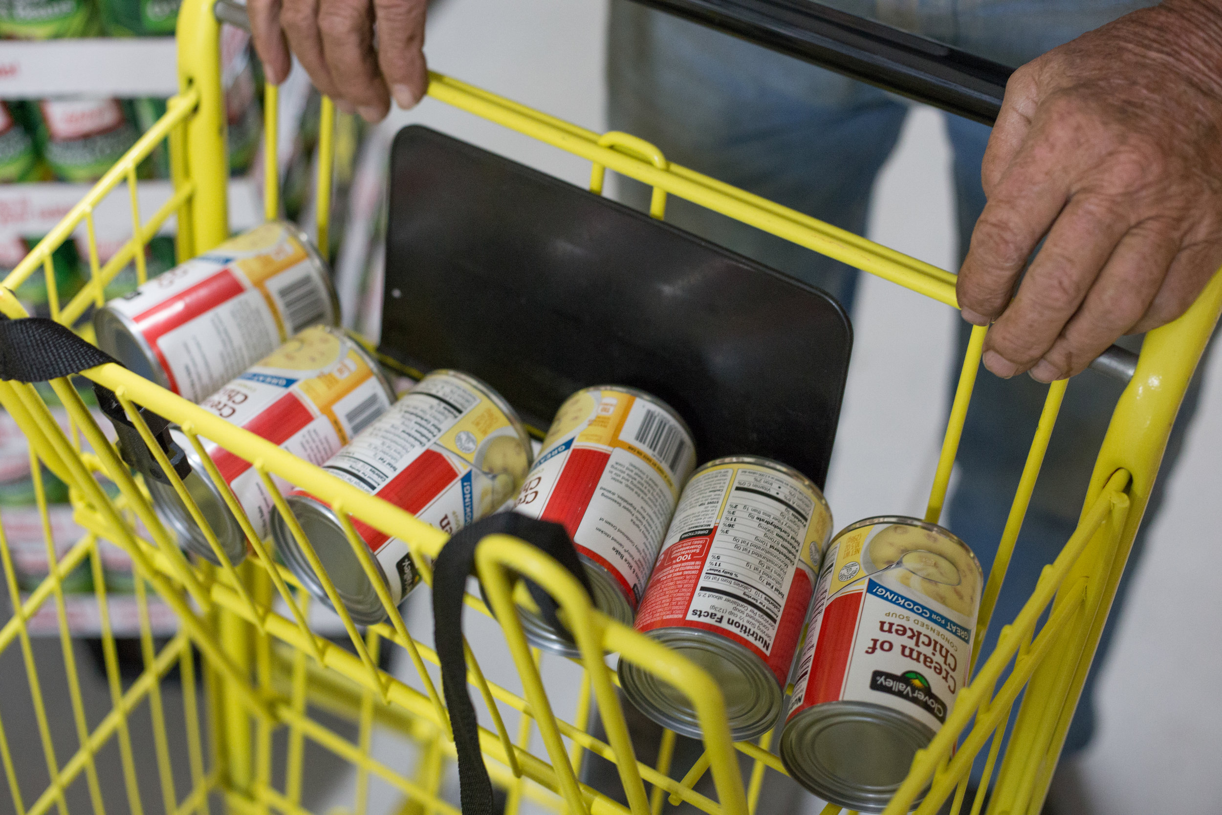  George Beaty of Evensville, Tenn. fills his shopping cart with cream of chicken soup for his neighbor who was not feeling well at Dollar General in Evensville, Tenn. Thursday, Nov. 16 2017. Store manager Justin Ray said that although the store does 