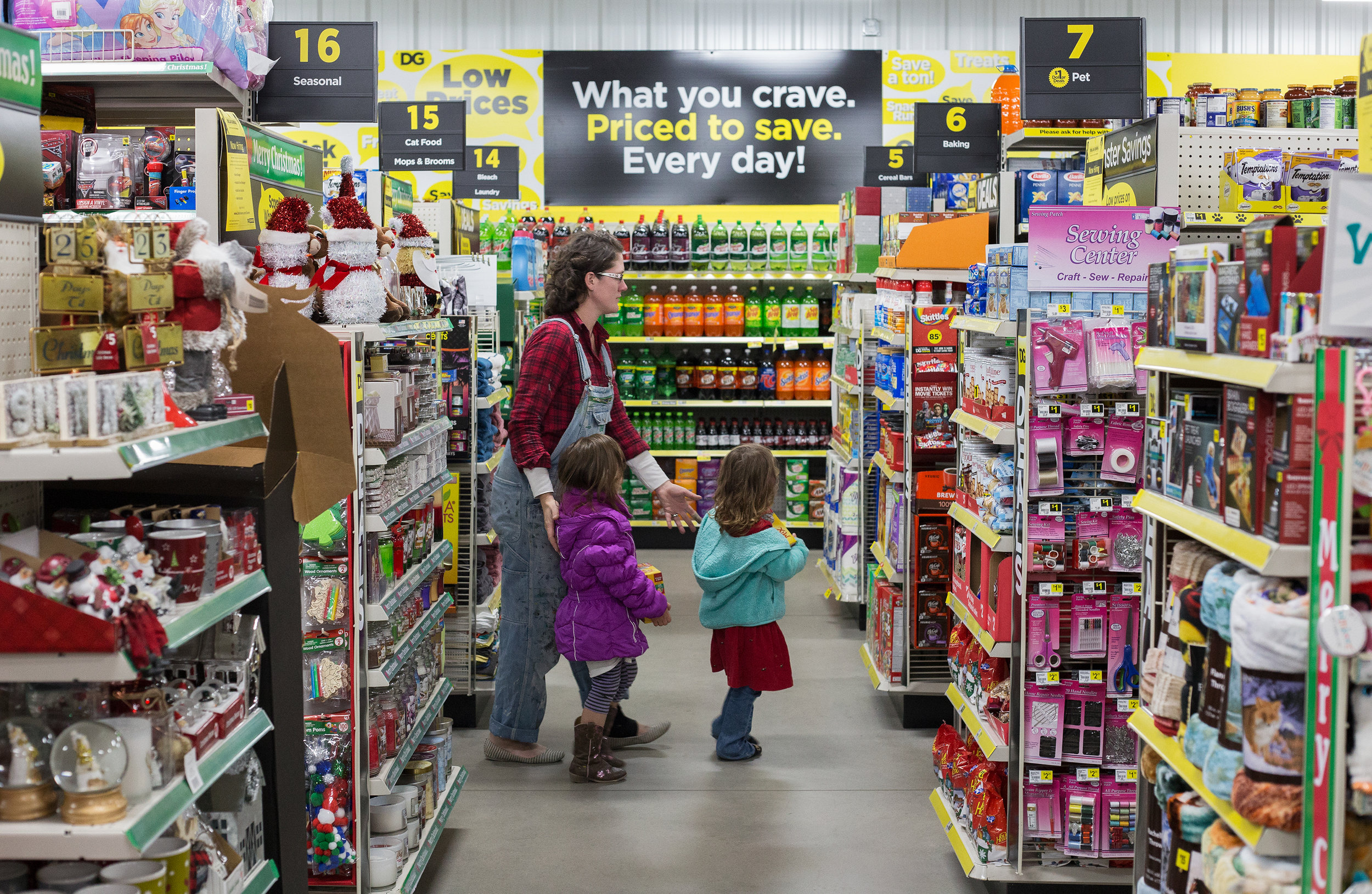  Local business owner Leah O’Neill, left, shops for cat food with her daughters Elizabeth and Emily O’Neill, 4, all of Evensville at Dollar General in Evensville, Tenn. Thursday, Nov. 16 2017.  