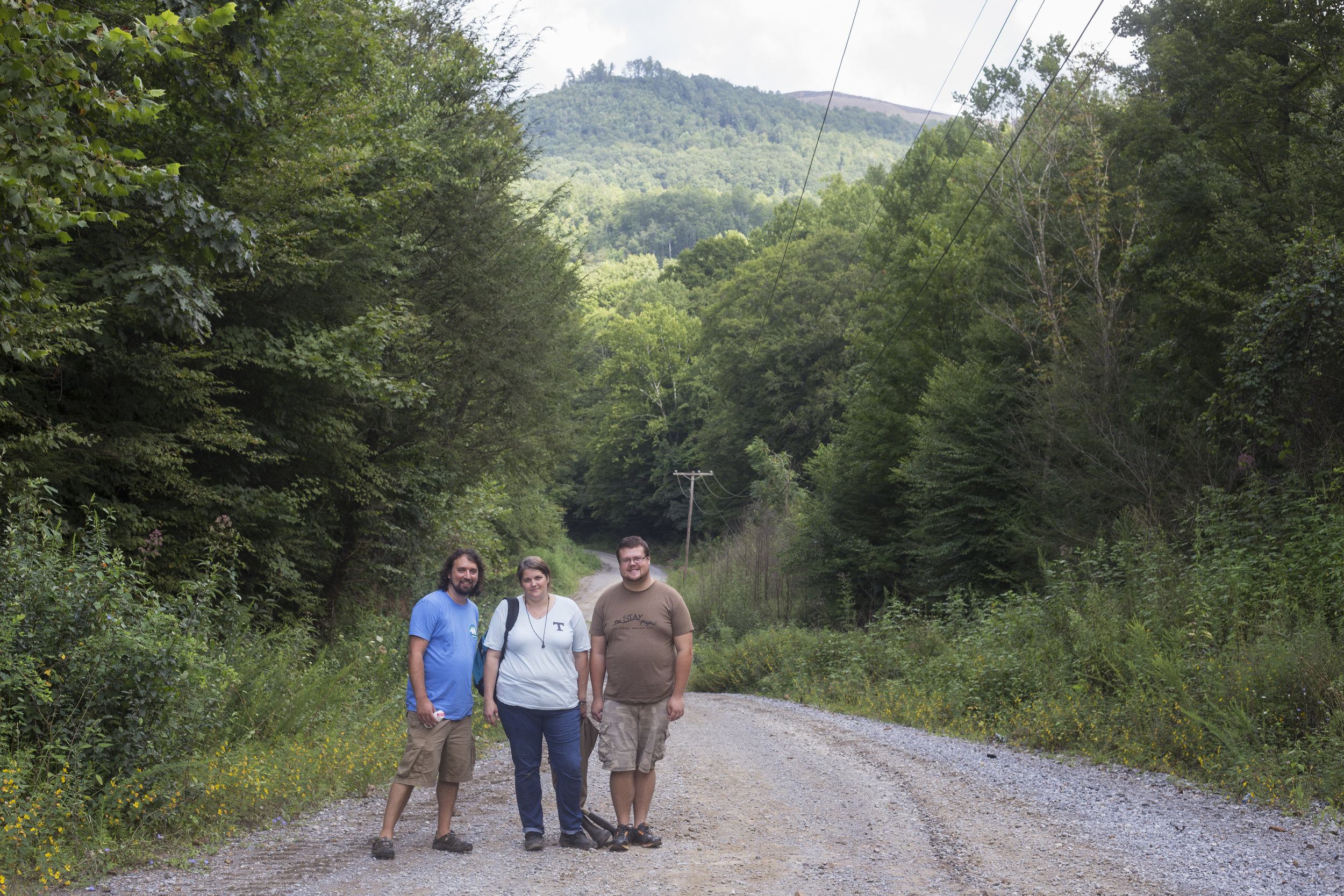  Matt Hepler, left, April Jarocki and Darrell James Coker stand before a mountaintop removal site in Eagan, Tenn. Wednesday, August 16, 2017. Jarocki and Coker are volunteers, trained by Hepler, for the Clearfork Community Institute as part of the Ap