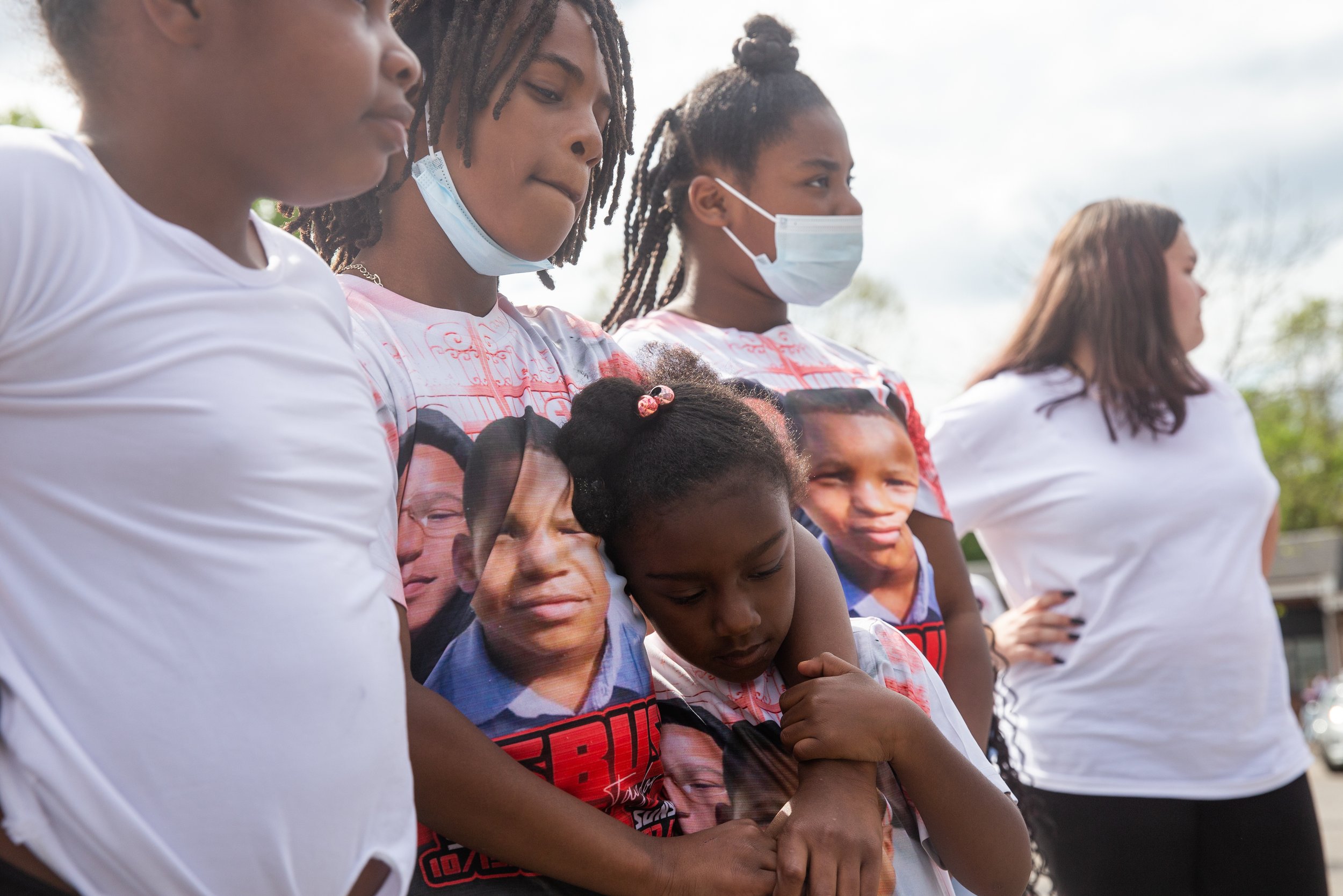  Jahi Mason, 11, center, holds his cousin Aubrey Taylor-Trice, 6, during the M.O.V.E in L.O.V.E Youth Rally. 