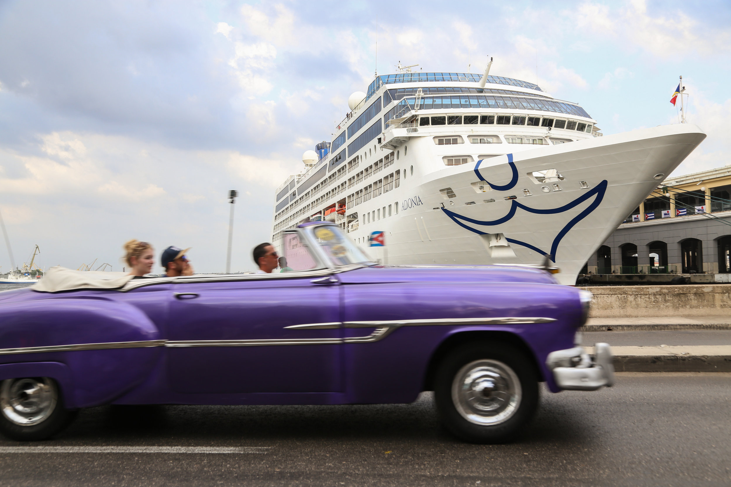 A vintage Cuban car drives by ‘The Adonia’, the first cruise to ship from the United States to Cuba in 55 years on May 2nd, 2016.