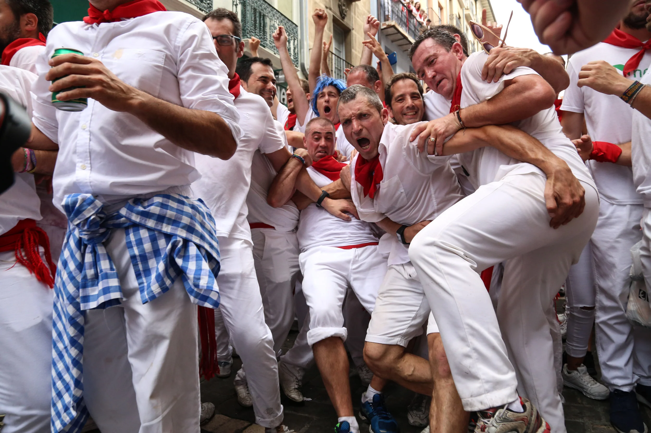 A member in charge of security for the bands playing around San Fermin holds people trying to push their way closer to the music player. - July 6th, 2017