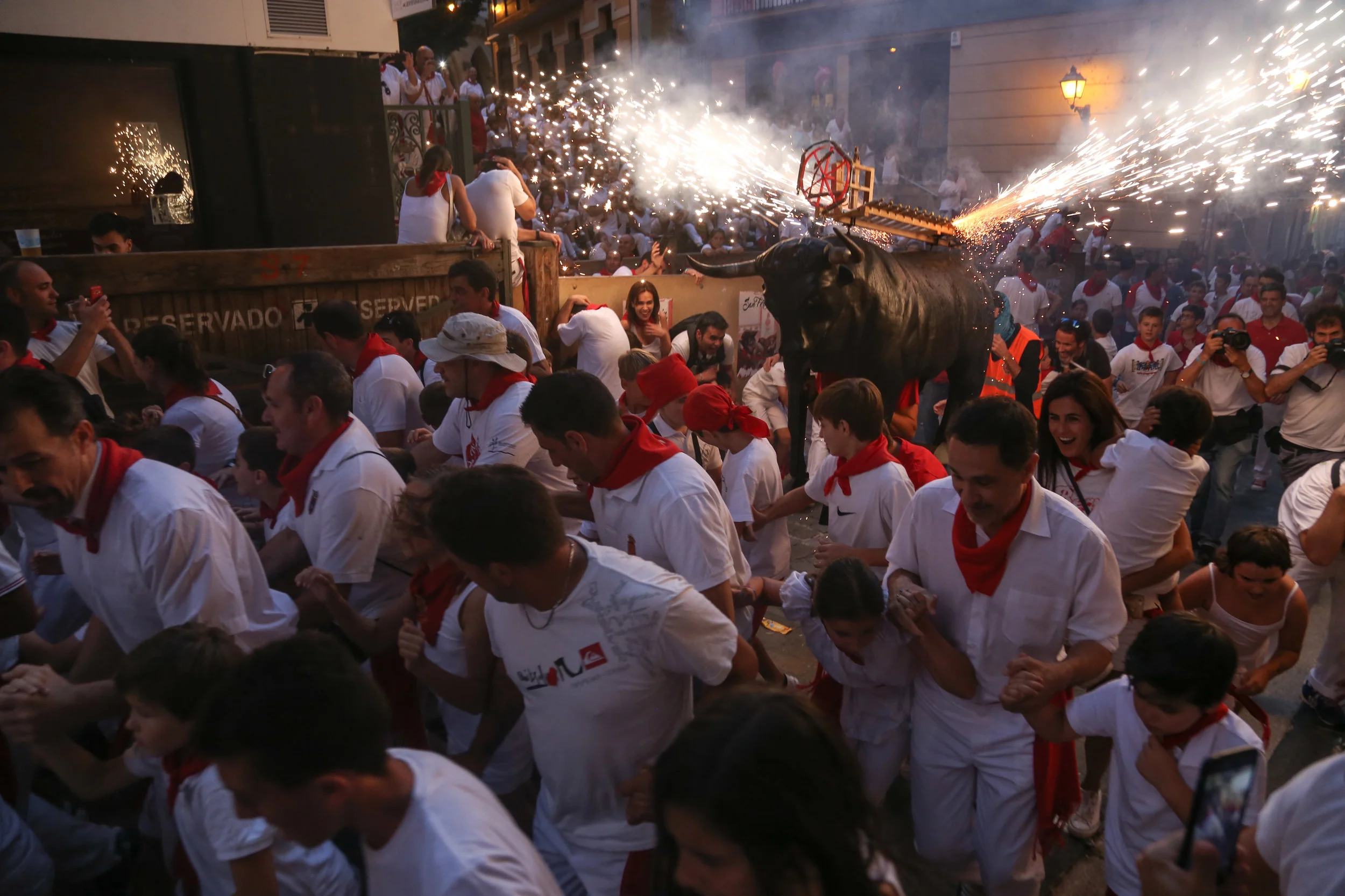 'The toro de fuego' (fire bull) goes through the streets of Pamplona as a safer alternative for people who don't want to be part of, the more dangerous, 'run off the bulls'. -July 7th, 2017.
