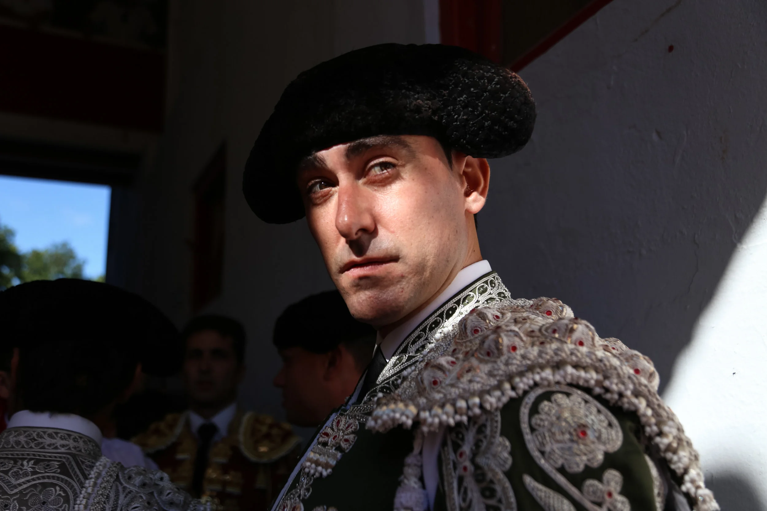 A flagmen looks out to the arena prior to the begining of a bullfight. -July 14th, 2017.