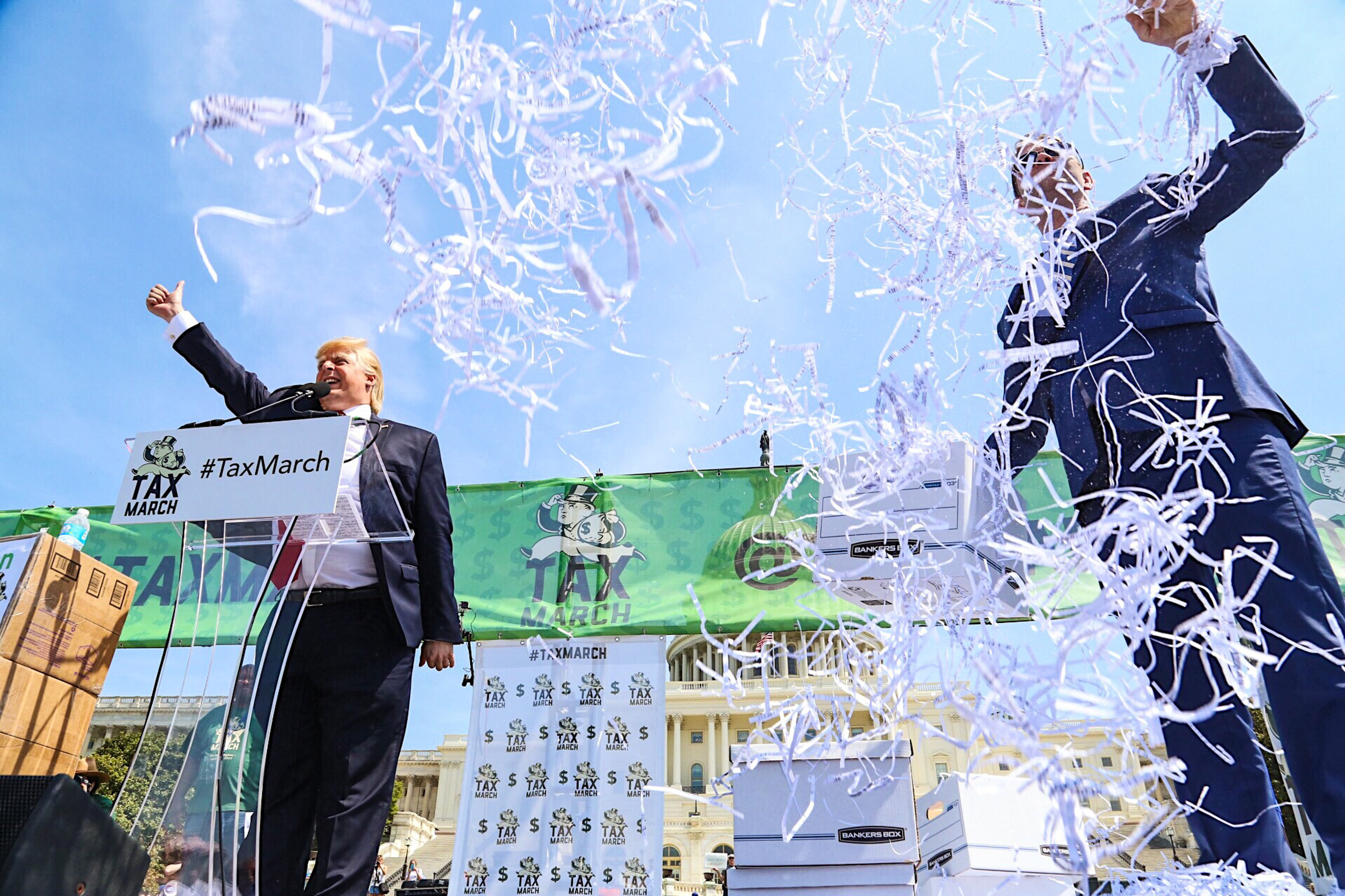 A President Trump impersonator mockingly "released" Trump's tax returns, hurling streams of shredded paperwork into the crowd during 'The Tax march' in Washington, D.C. -April 15th, 2017.