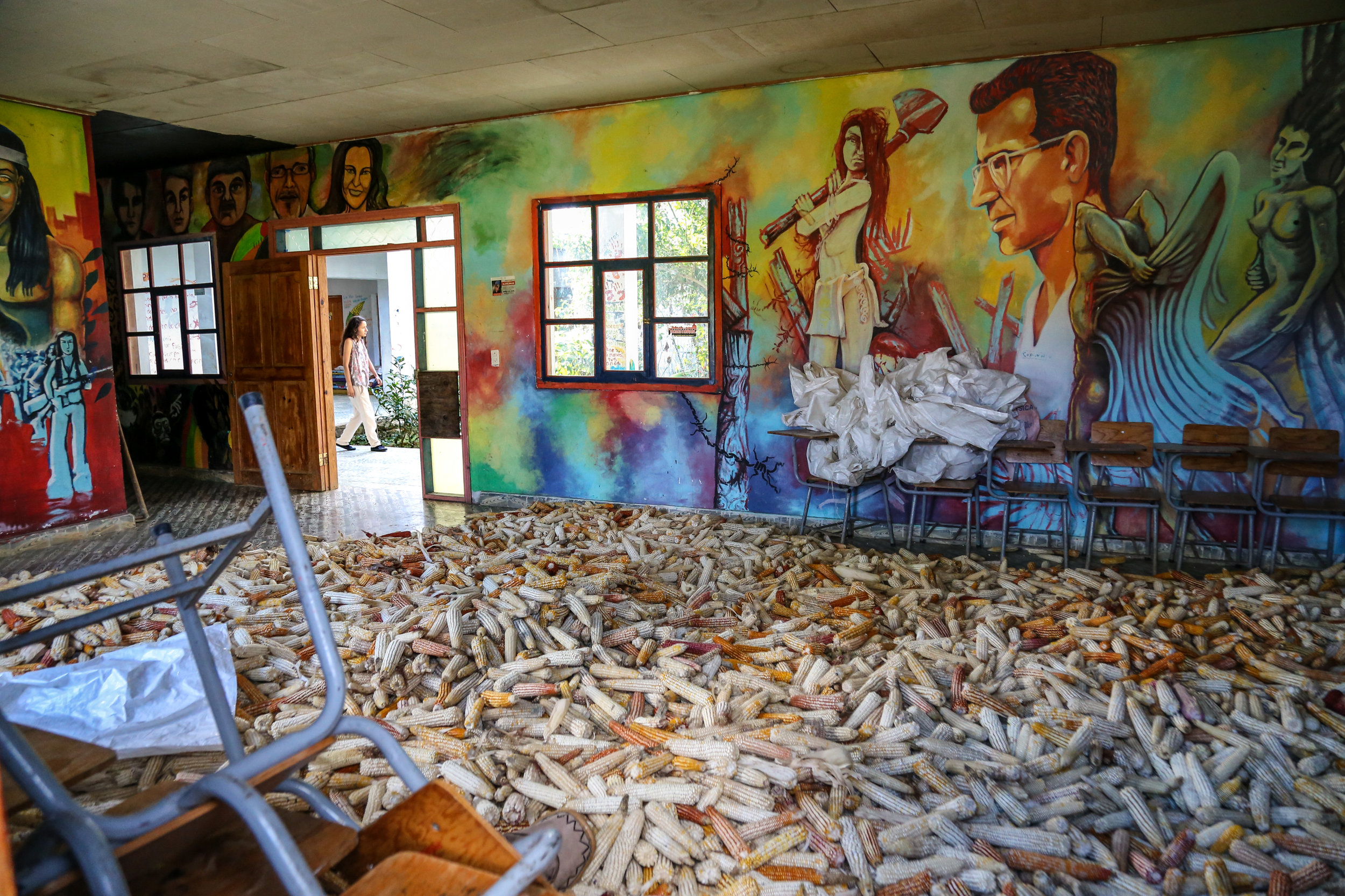 On December 19th, 2016 Berta Isabel Zúñiga Cáceres walks by one of the rooms in Centro Utopía, COPINH's community center, where Lenca people often meet to discuss issues that affect the community, share meals, educate their children on the anti-capitalist, feminist and anti-imperialist movement, among others. 