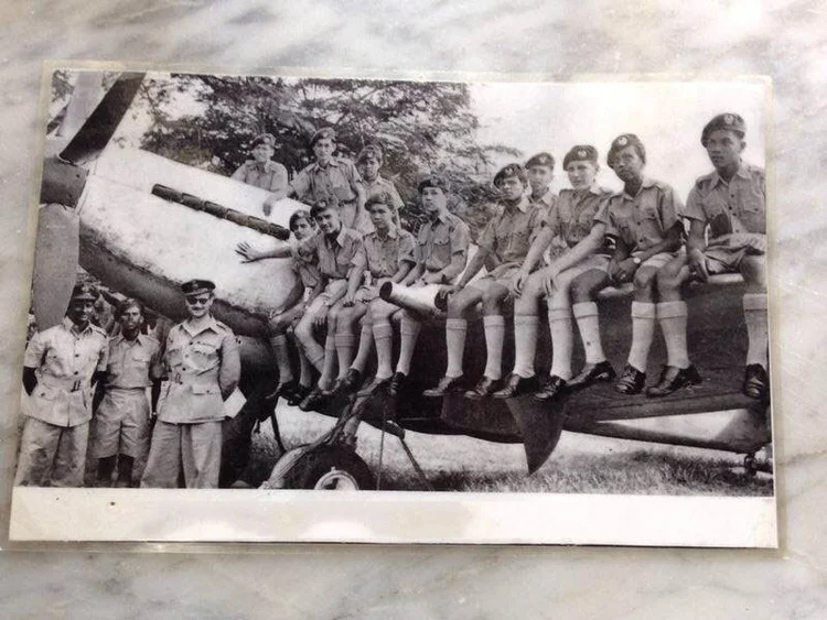An old photo of Peter in the Malayan Air Training Corps. Peter is seated, 4th from the left on the wing of the British Royal Air Force Spitfire aircraft. The man with the sunglasses is MATC Commandant, Johnny Behague. (photo Courtesy of Peter Lim's personal albums) 