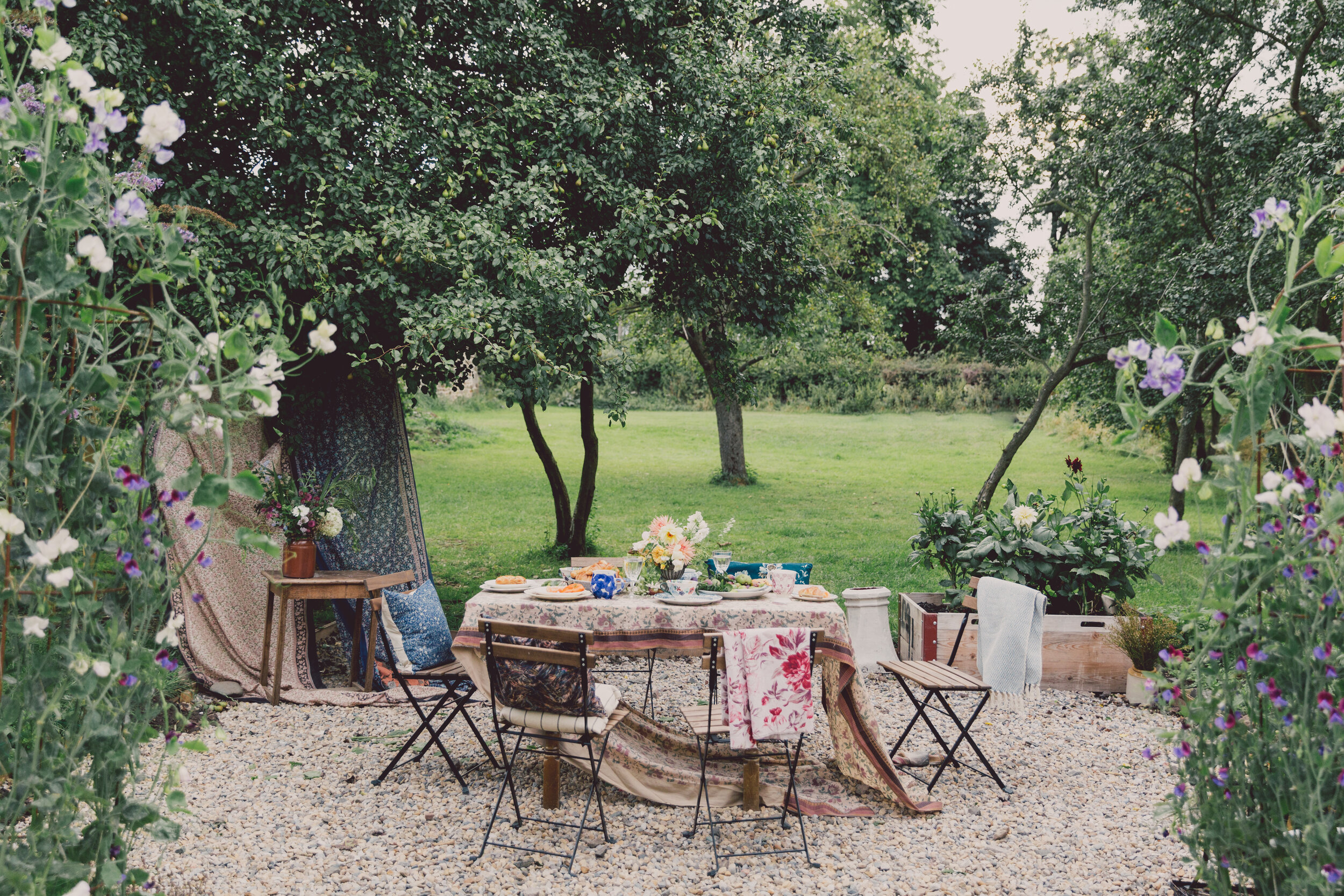 Lifestyle brand content photography of table in garden with flowers by charlotte eve photography