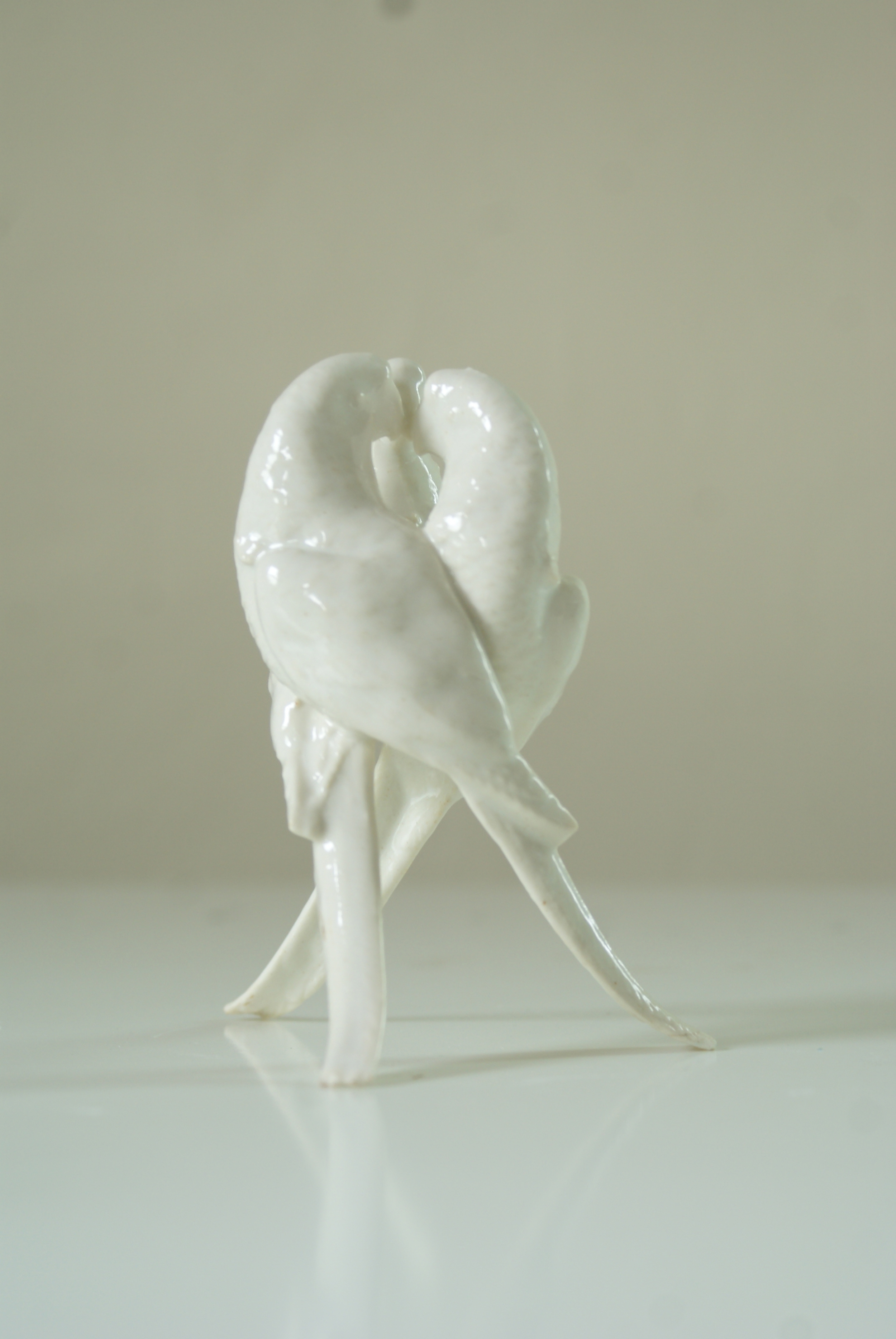 SLIP CASTING Small forms poured in porcelain and glazed. Candlesticks, parrots, etc...