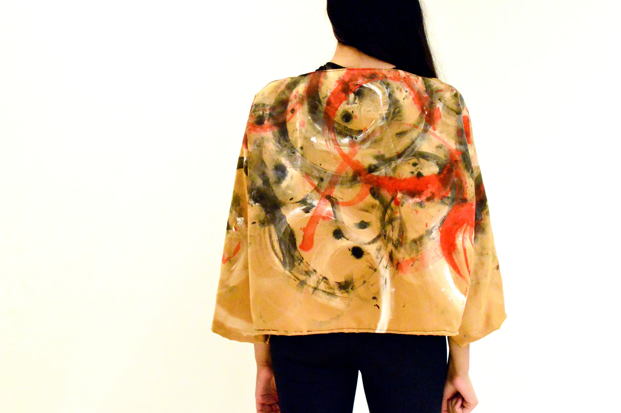  Top: Inspired by binding and sports bras. The back hooks together like a bra and the strap around the stomach connects with a hook in the back. Fabric used was black spandex along with leather straps.&nbsp;  Jacket: The jacket was a copper colored s