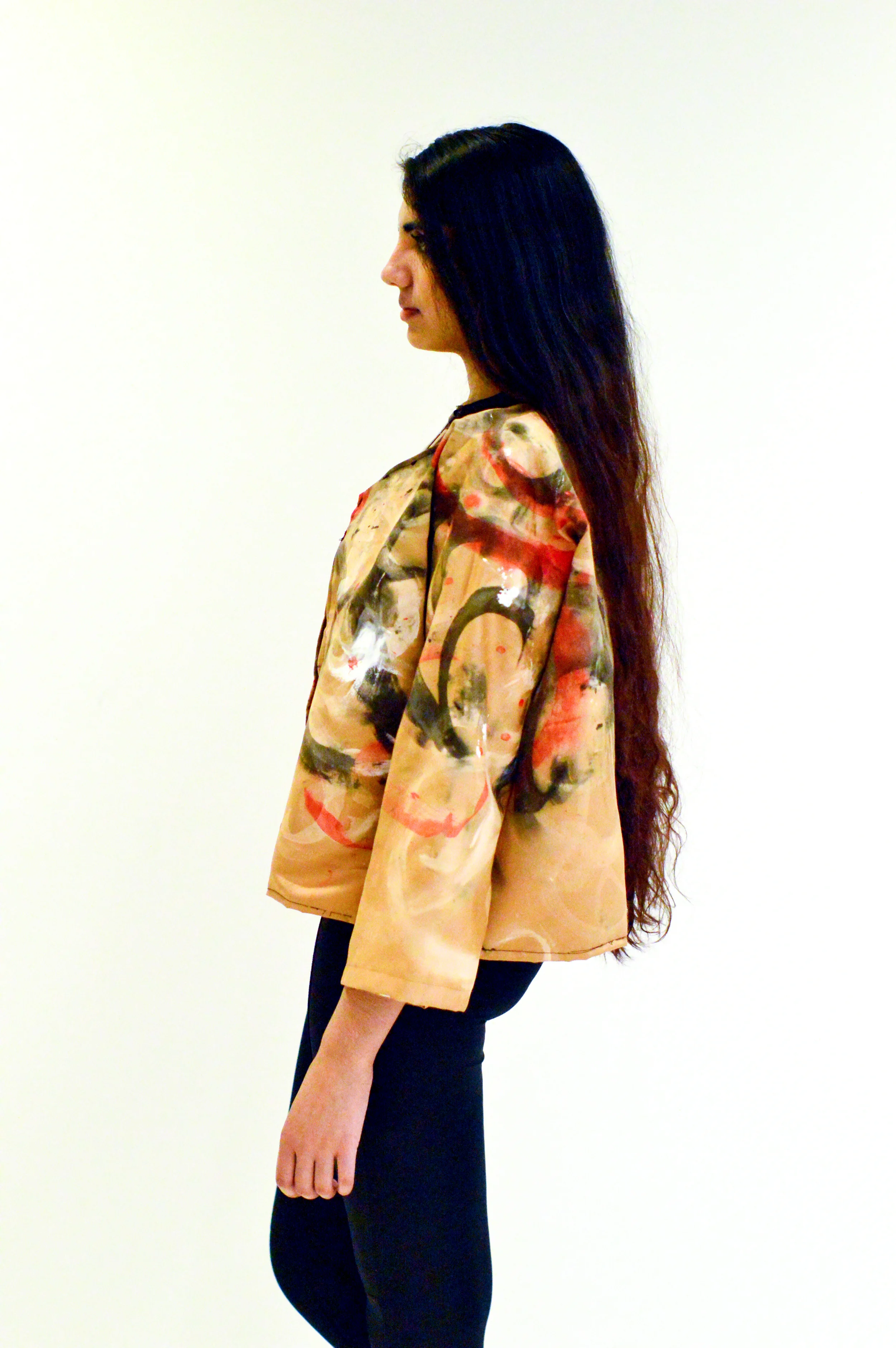  Top: Inspired by binding and sports bras. The back hooks together like a bra and the strap around the stomach connects with a hook in the back. Fabric used was black spandex along with leather straps.&nbsp;  Jacket: The jacket was a copper colored s