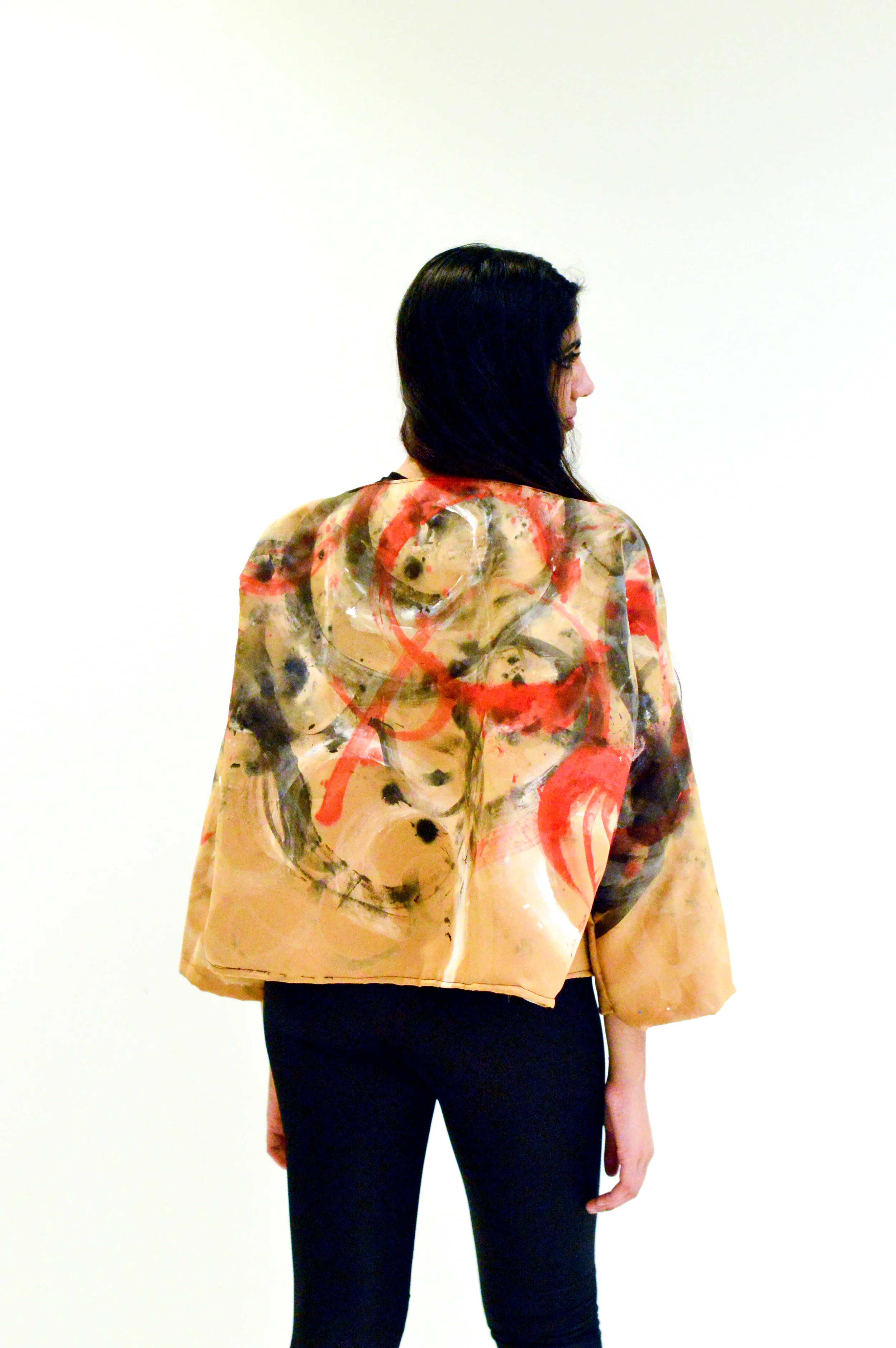  Top: Inspired by binding and sports bras. The back hooks together like a bra and the strap around the stomach connects with a hook in the back. Fabric used was black spandex along with leather straps.&nbsp;  Jacket: The jacket was a copper colored s