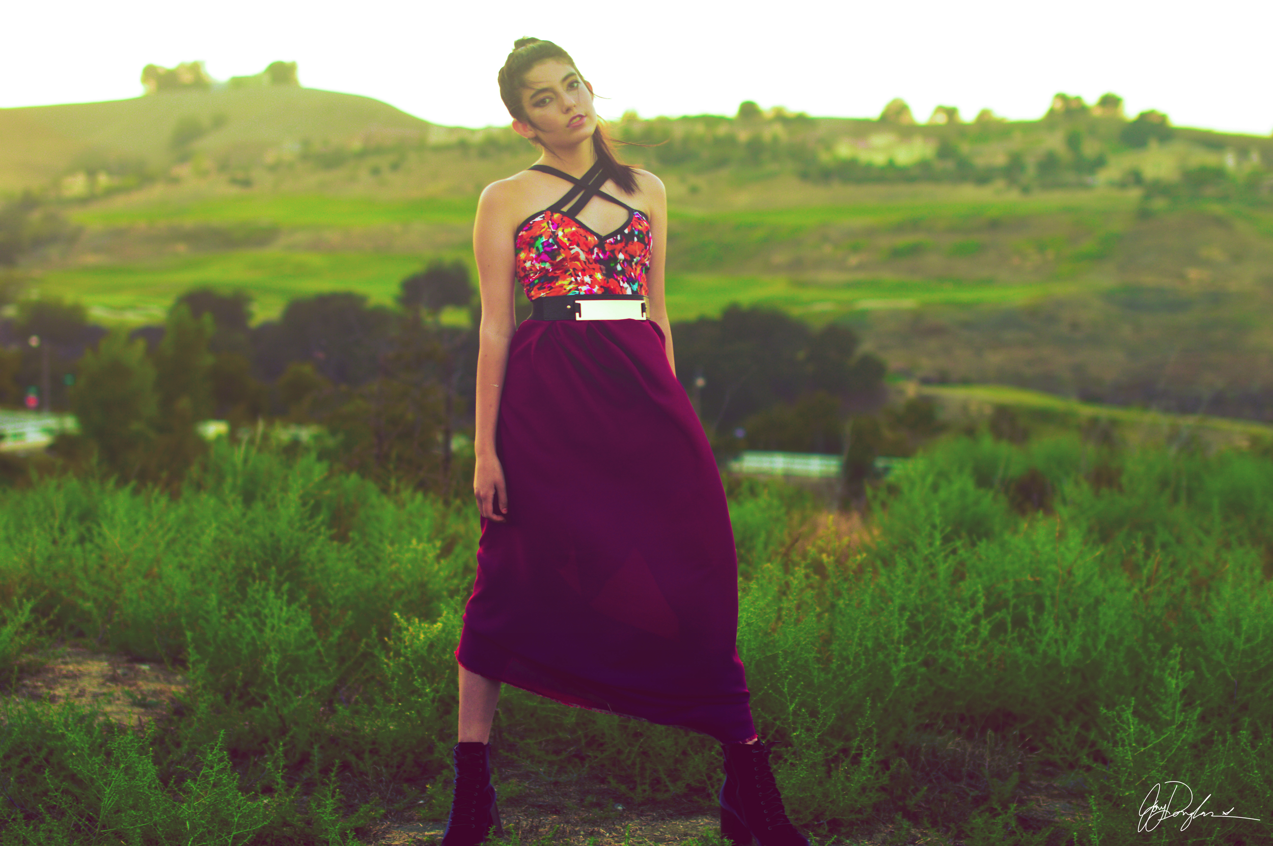  Multicolor stretch denim bodice with attached double layer chiffon skirt. The bottom of the dress is long, but styled short in this picture. Three straps criss cross in the front of the dress.&nbsp;  Model: Romy Flores Hair styling: Kevin Tate MUA: 