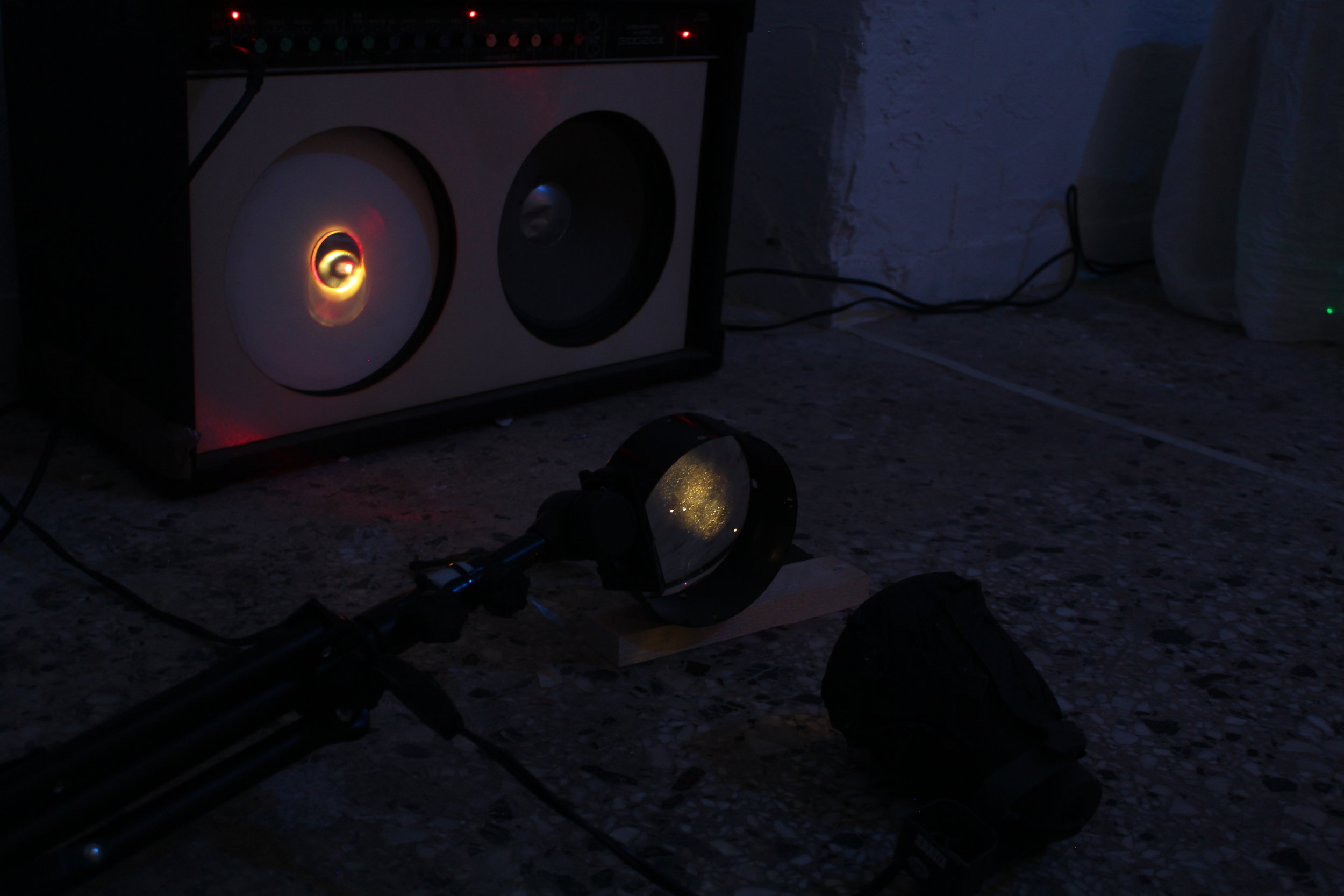  Detail of installation room 2. Guitar amplifier,&nbsp;mirror,&nbsp;balloon, laser, LED light, enlarger lens. 
