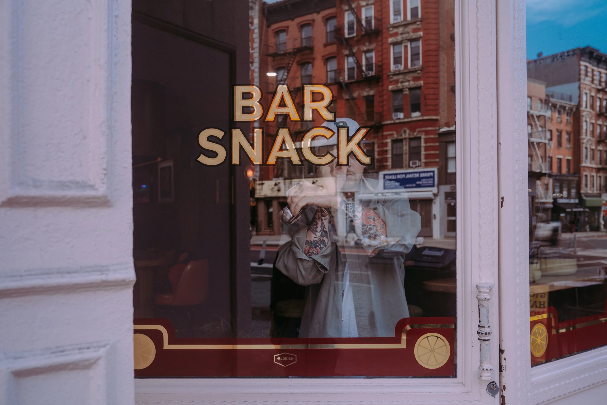 Gilded logo on windows for Bar Snack