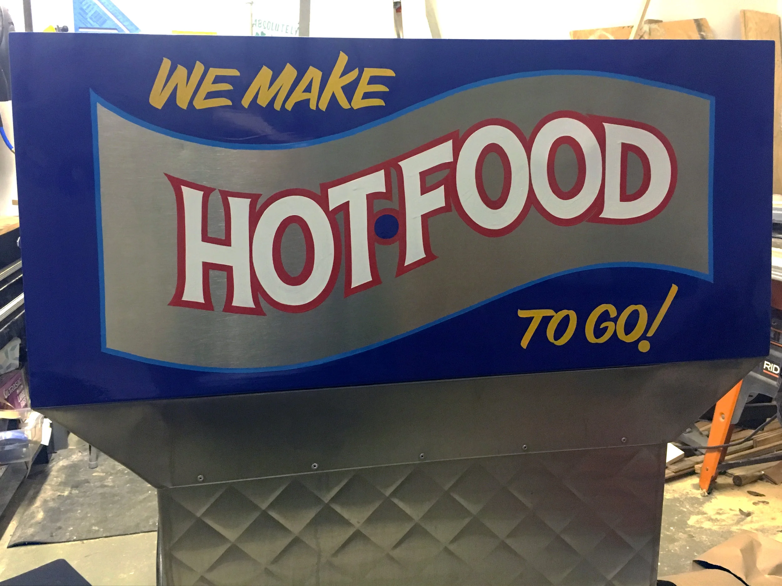 Rust & Gold food cart painted by hand - outside their bar when the weather is nice.