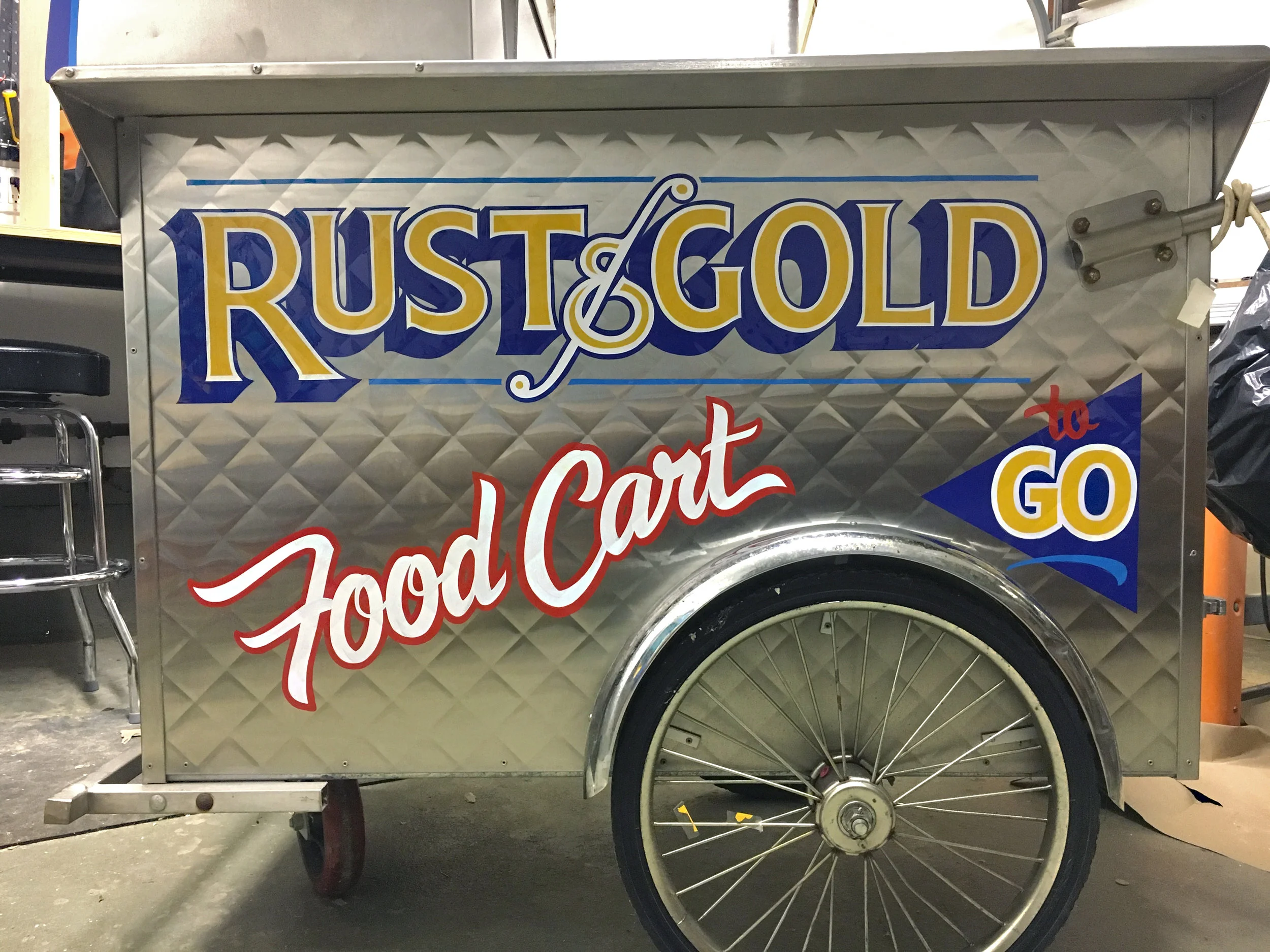 Rust & Gold food cart painted by hand - outside their bar when the weather is nice.