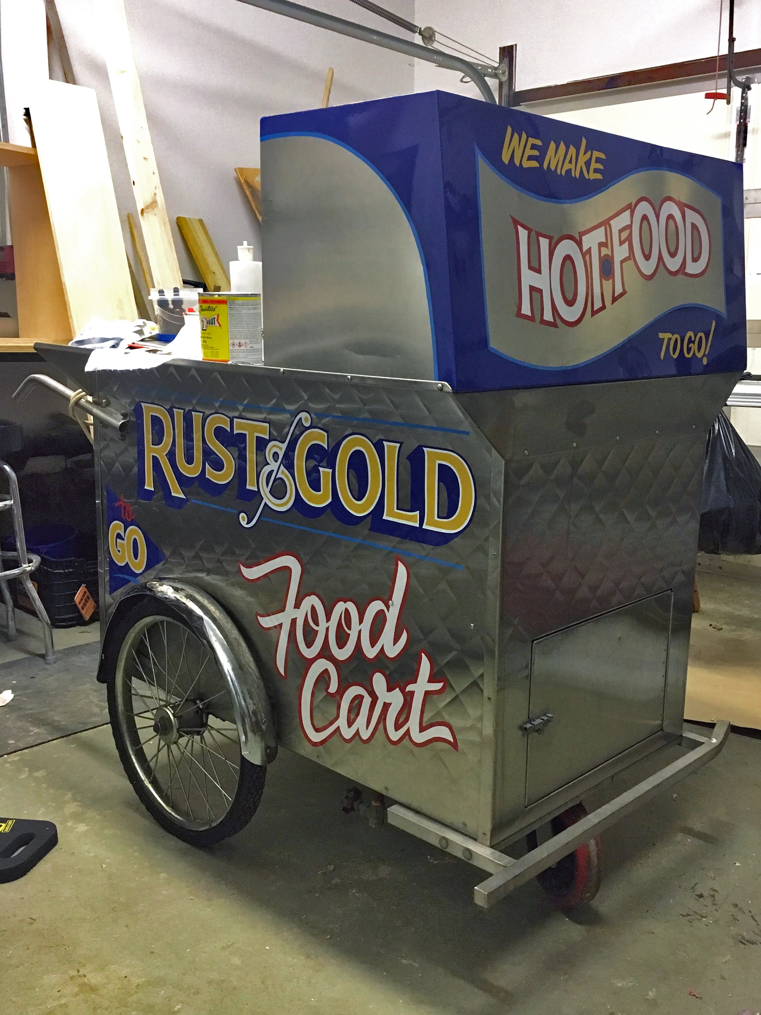 Rust & Gold food cart painted by hand - outside their bar when the weather is nice.