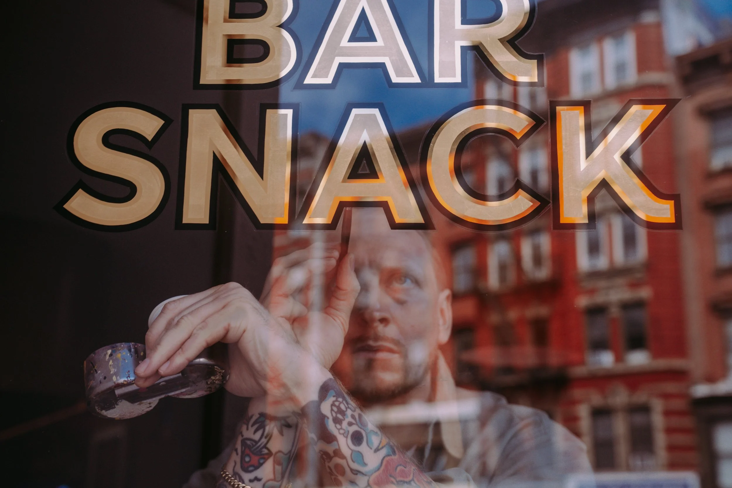 Gilded logo for Bar Snack window painted by hand with gold leaf