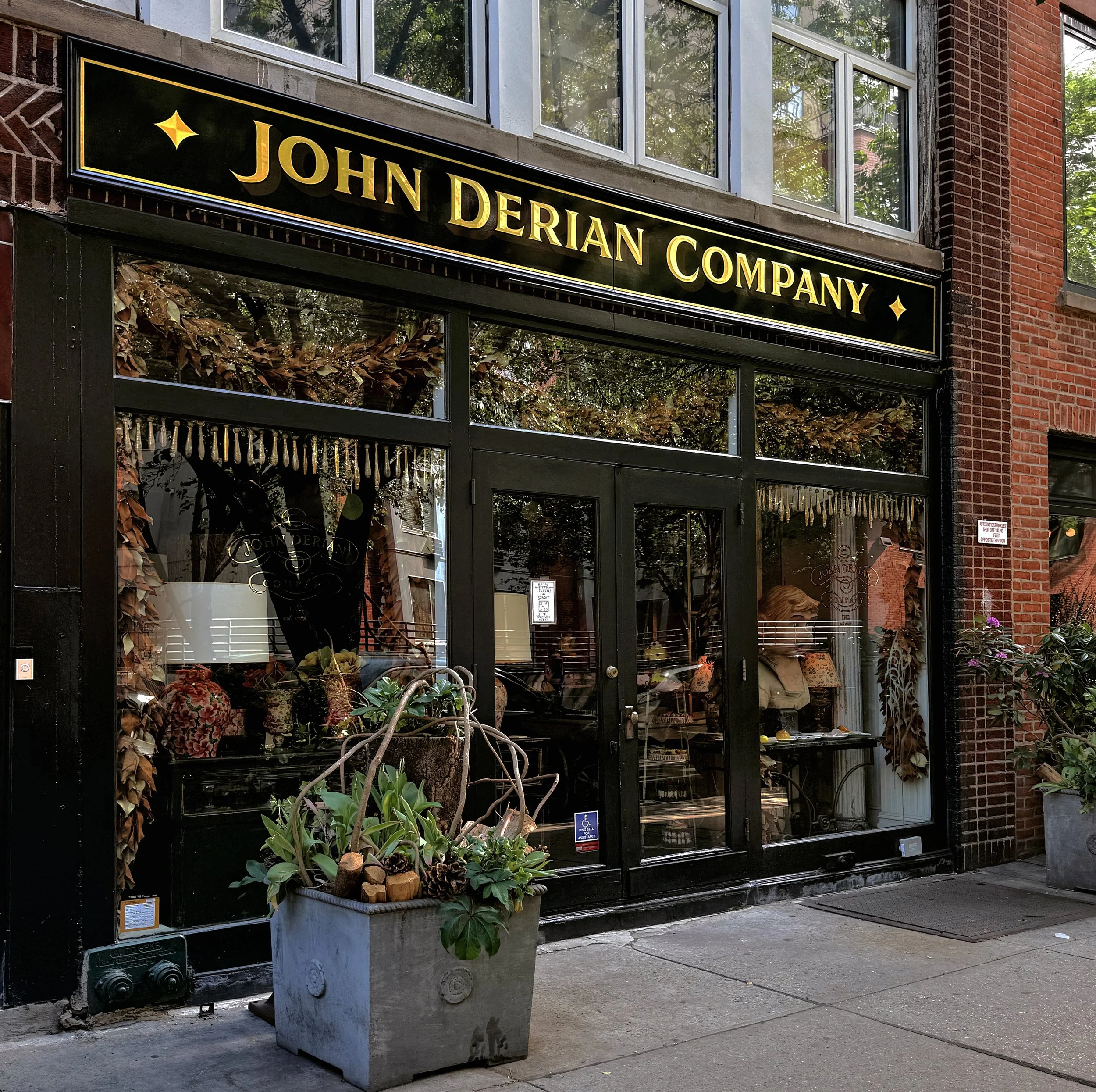 Hand painted and gilded exterior sign with 23k gold leaf and convex burnished letters for John Derian Co. in the East Village, NYC.