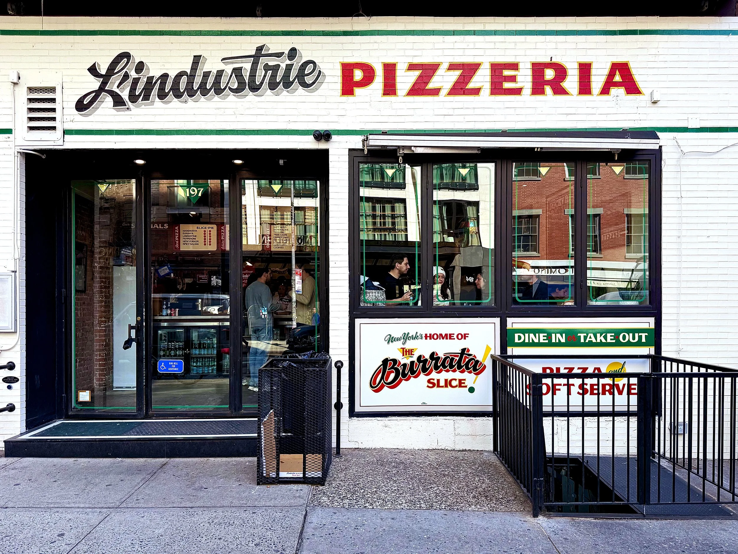 Storefront designed and hand painted signs and windows for L'industrie Pizzeria in Little Italy, NYC