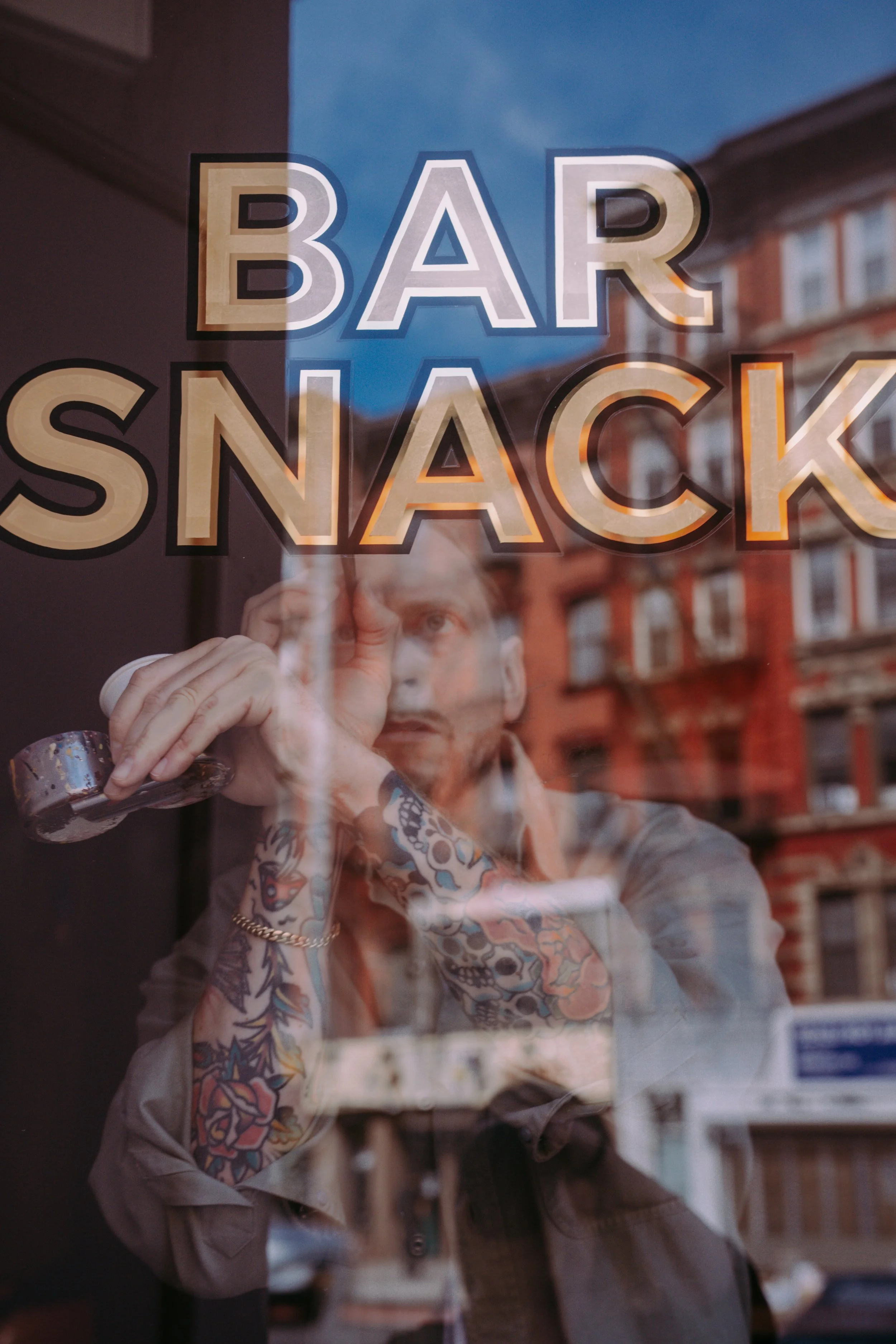 Gilded logo on window with 23k gold leaf.