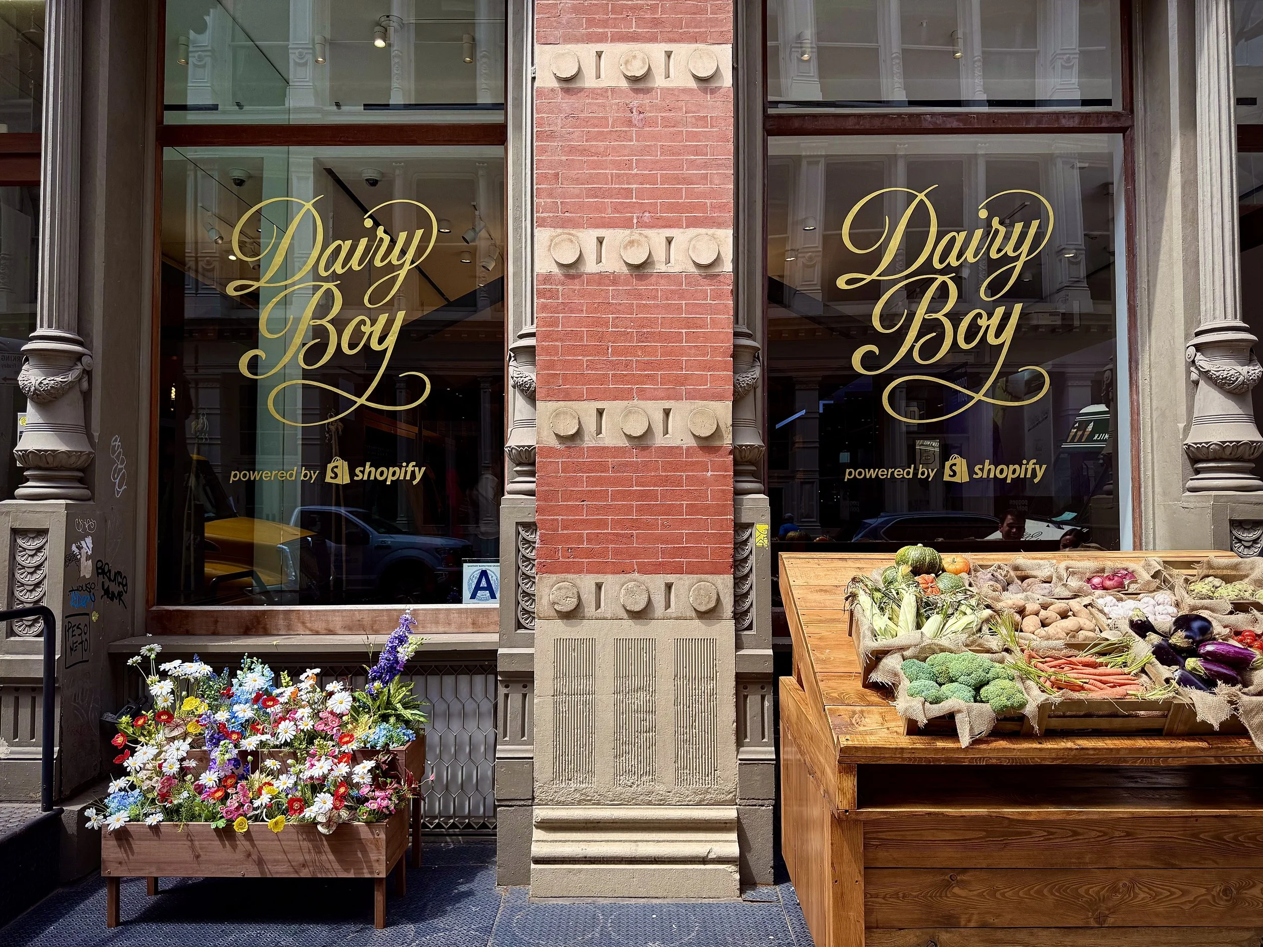 Gilded script logo for Dairy Boy in 23k gold leaf.