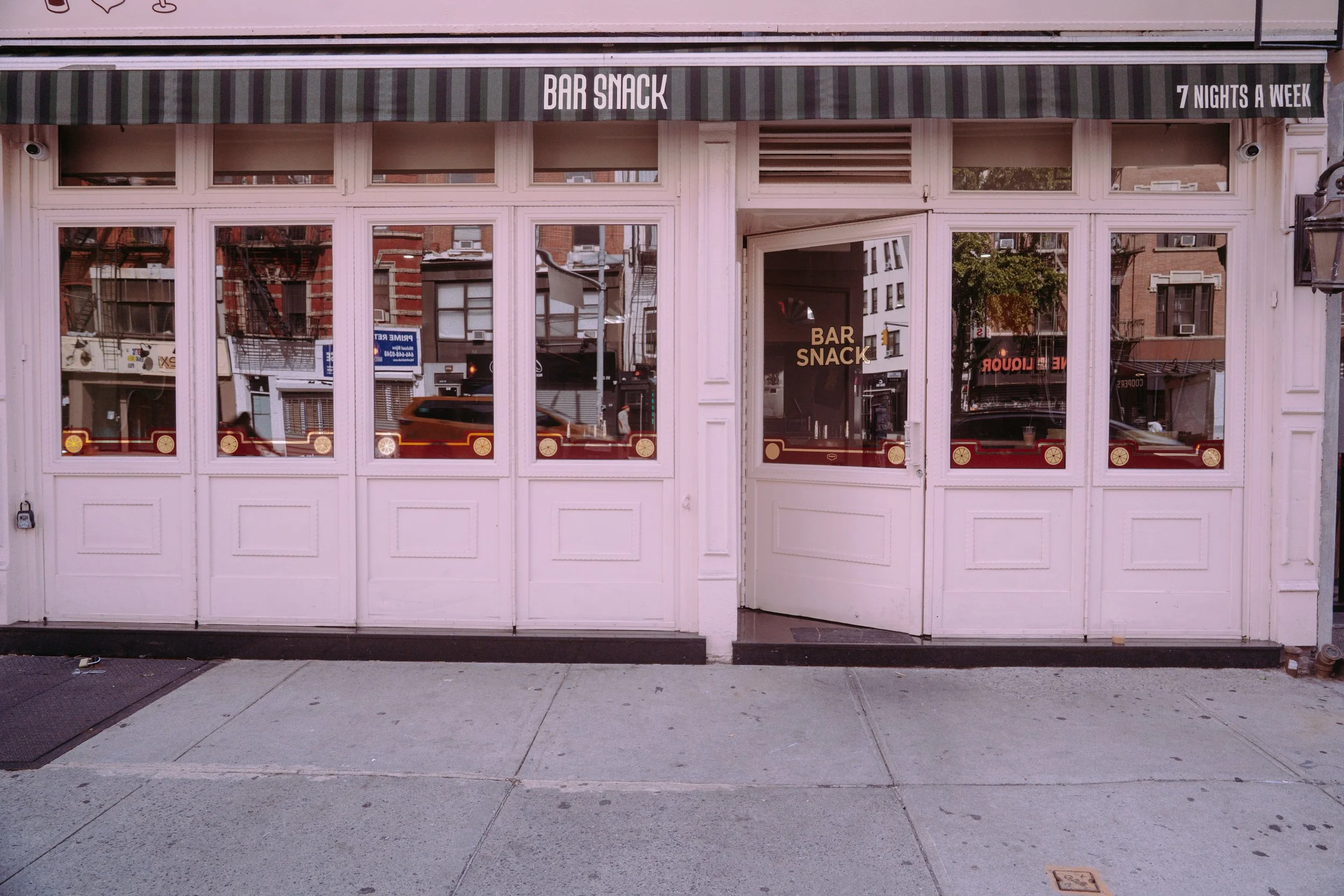 Custom storefront designed and hand painted with gold leaf details
