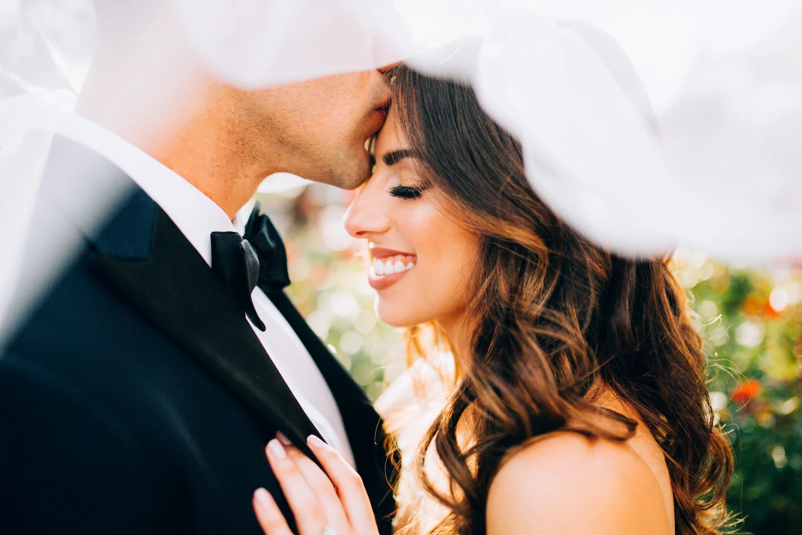 Groom Giving Bride Forehead Kiss under veil Armature Works Tampa Florida