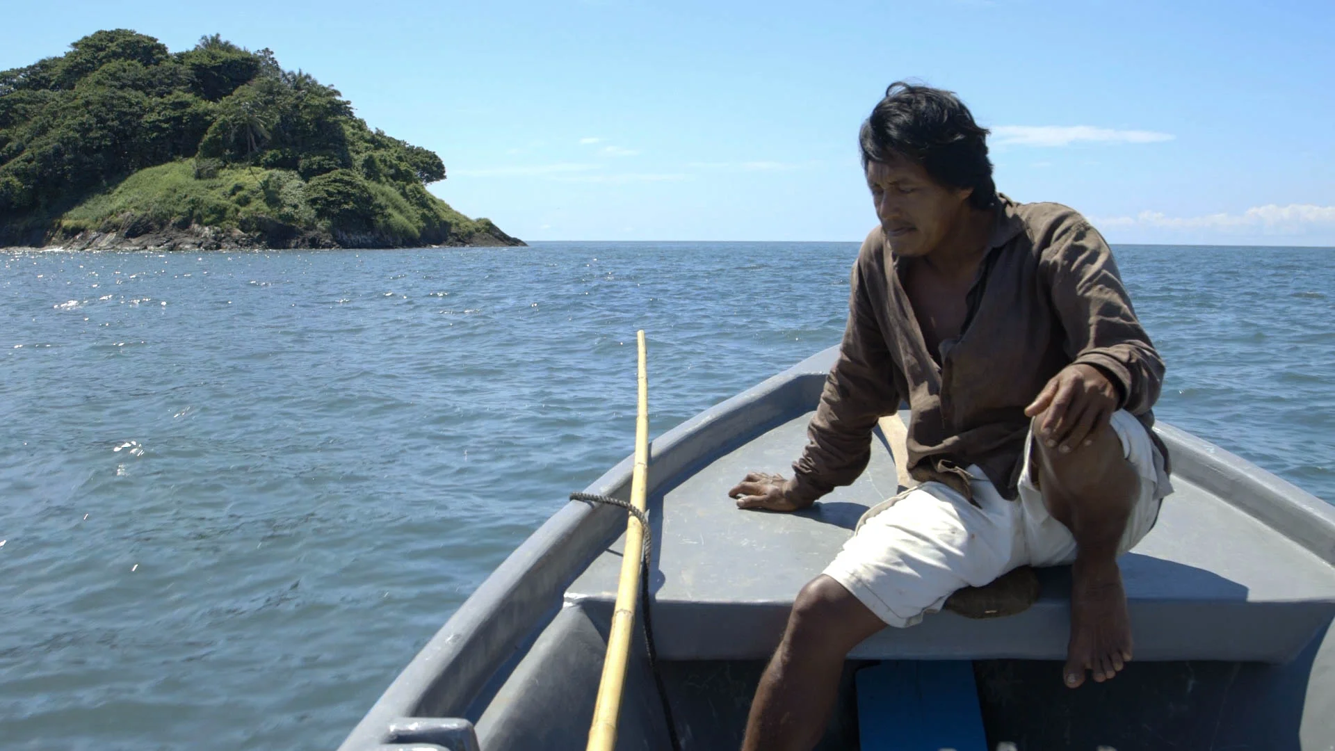 Pop on prow of boat, heading to Booby Cay - video still, Tom Miller