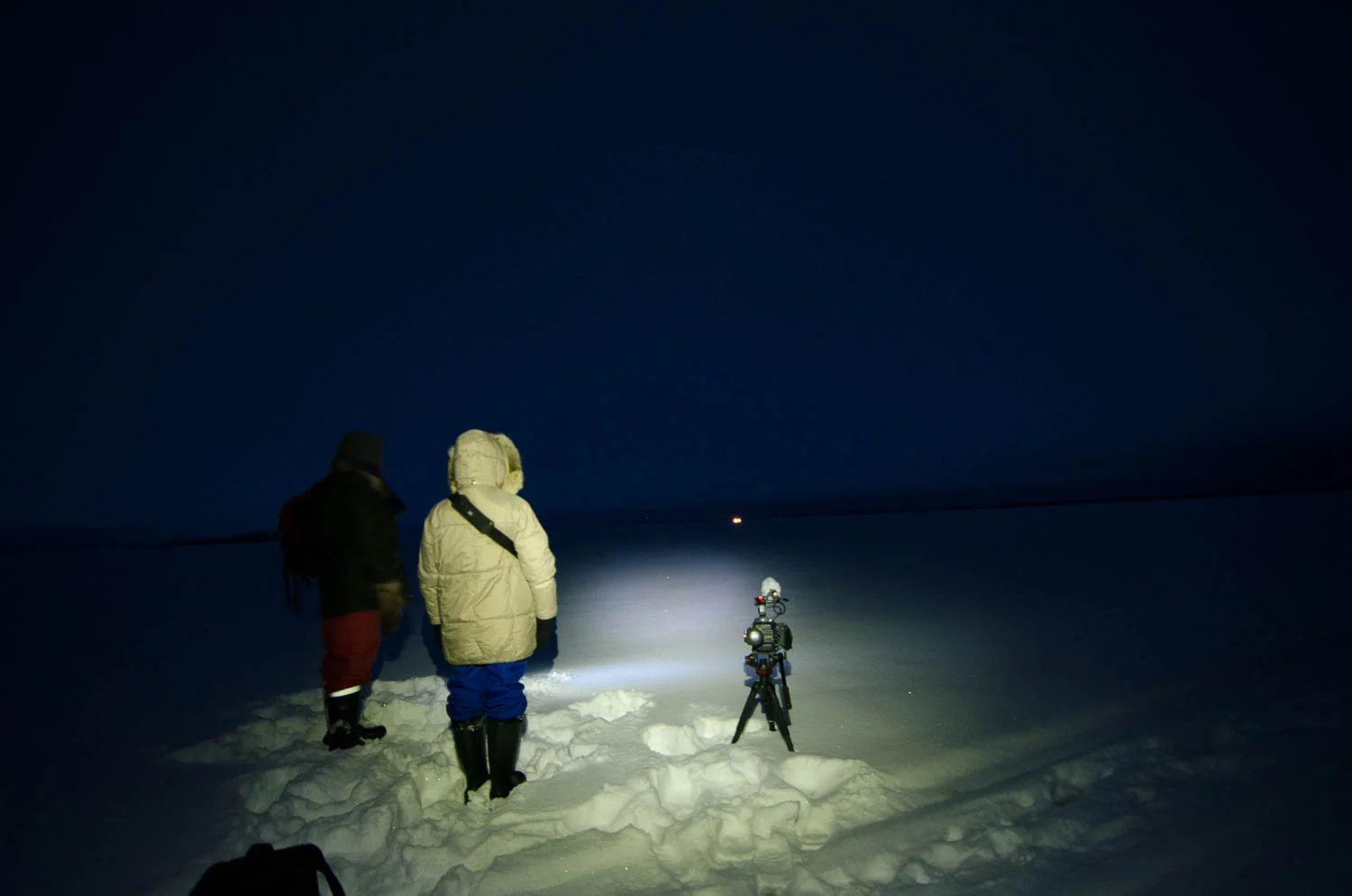 Waiting for the Light - you can see our Skidoo's headlights in the distance