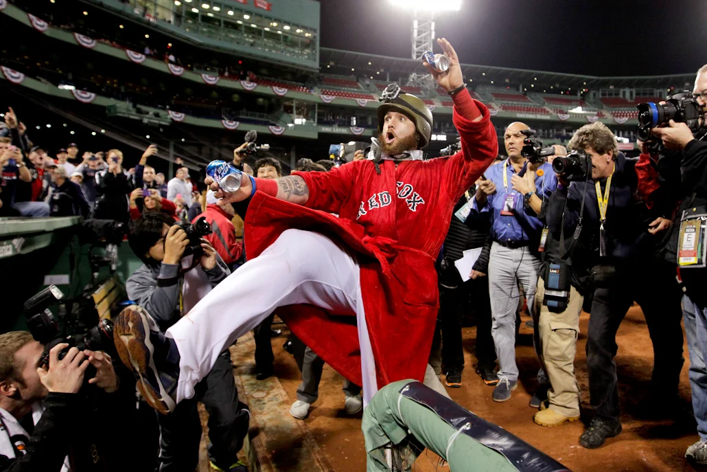 Boston Red Sox left fielder Jonny Gomes celebrates after the Red Sox won the American League Championship after defeating the Detroit Tigers in six games at Fenway Park in Boston on October 19, 2013. 