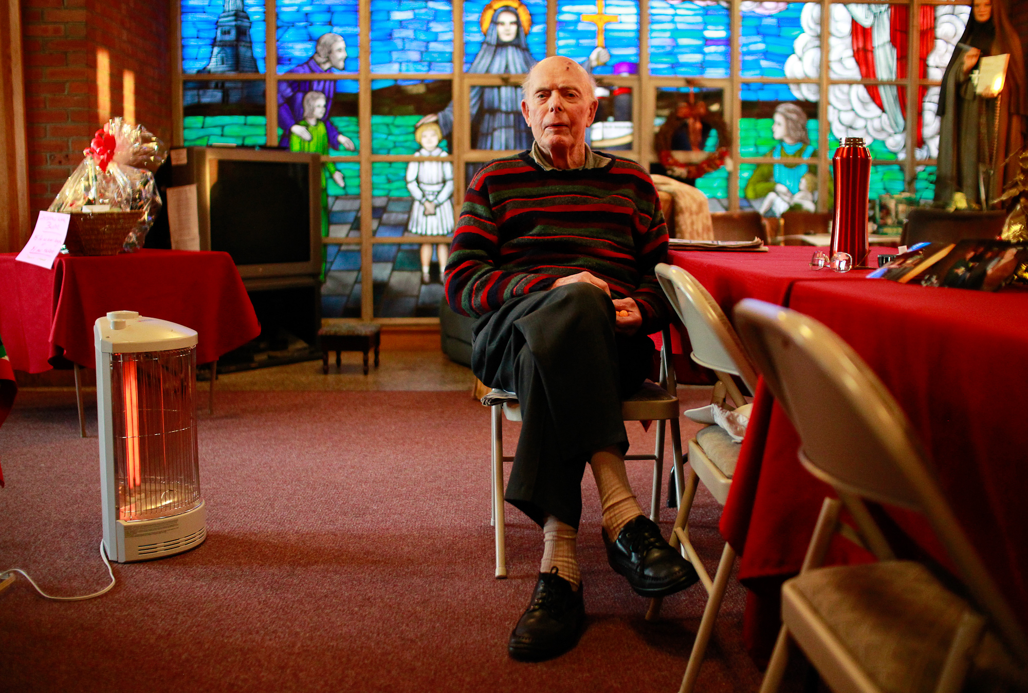  George P. Kelly of Scituate, MA, long time parishioner of St. Frances Xavier Cabrini church, sits for a photo in the vestibule of the church while sitting vigil on Thursday, December 1, 2011 in Scituate, Massachusetts.&nbsp; Mister Kelly and his fel