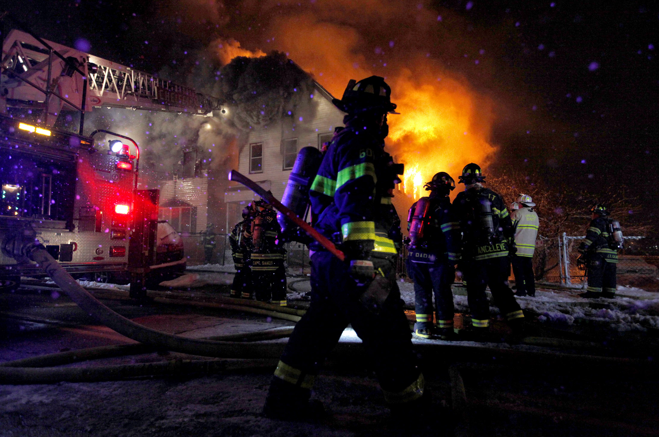 Chelsea firefighters battle a blaze at 375 and 373 Crescent Avenue in Chelsea, Massachusetts on Saturday, January 24, 2015. 